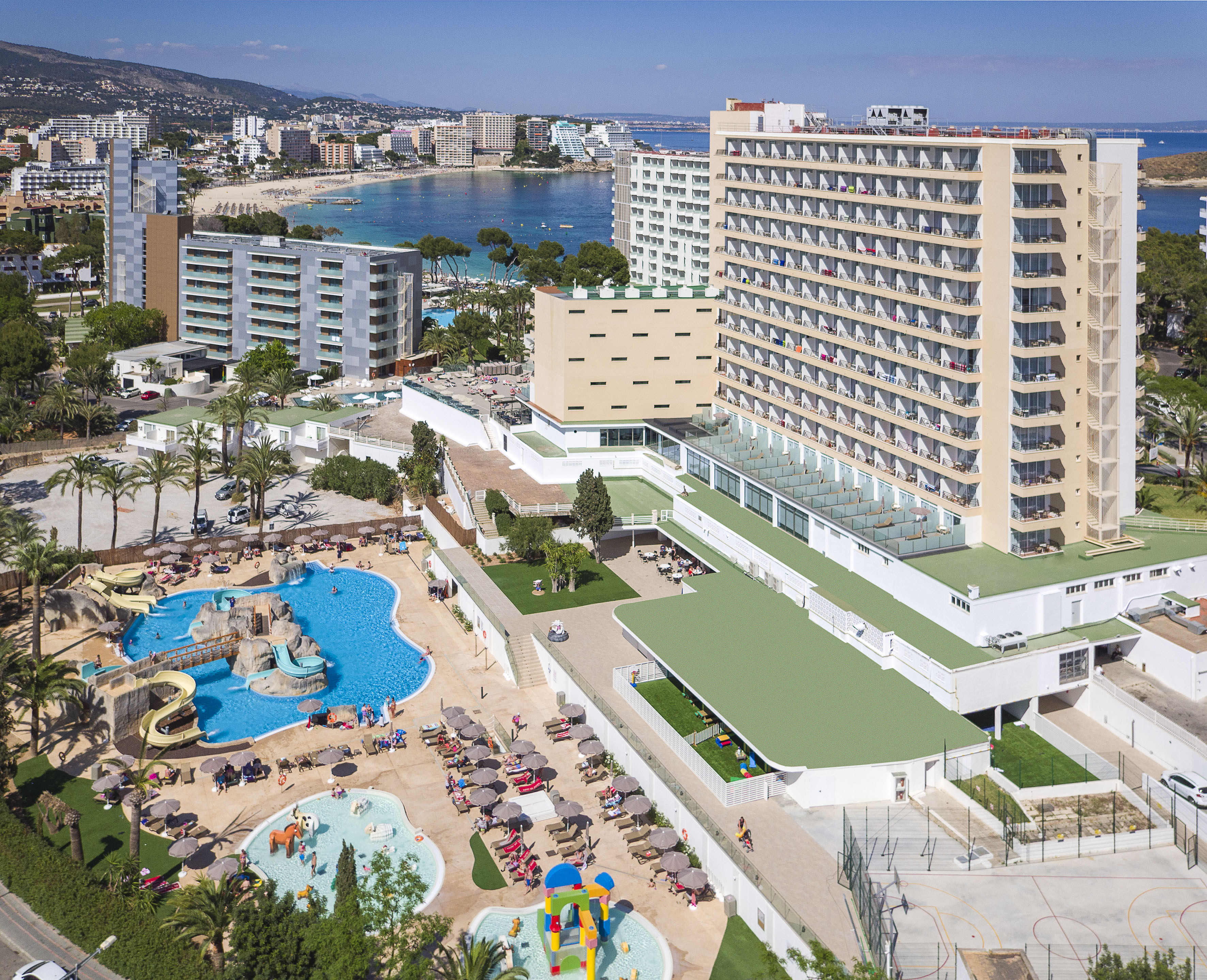a large hotel with a pool and water park
