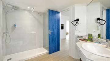 a bathroom with a blue door and a sink