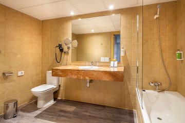 a bathroom with a sink and a shower