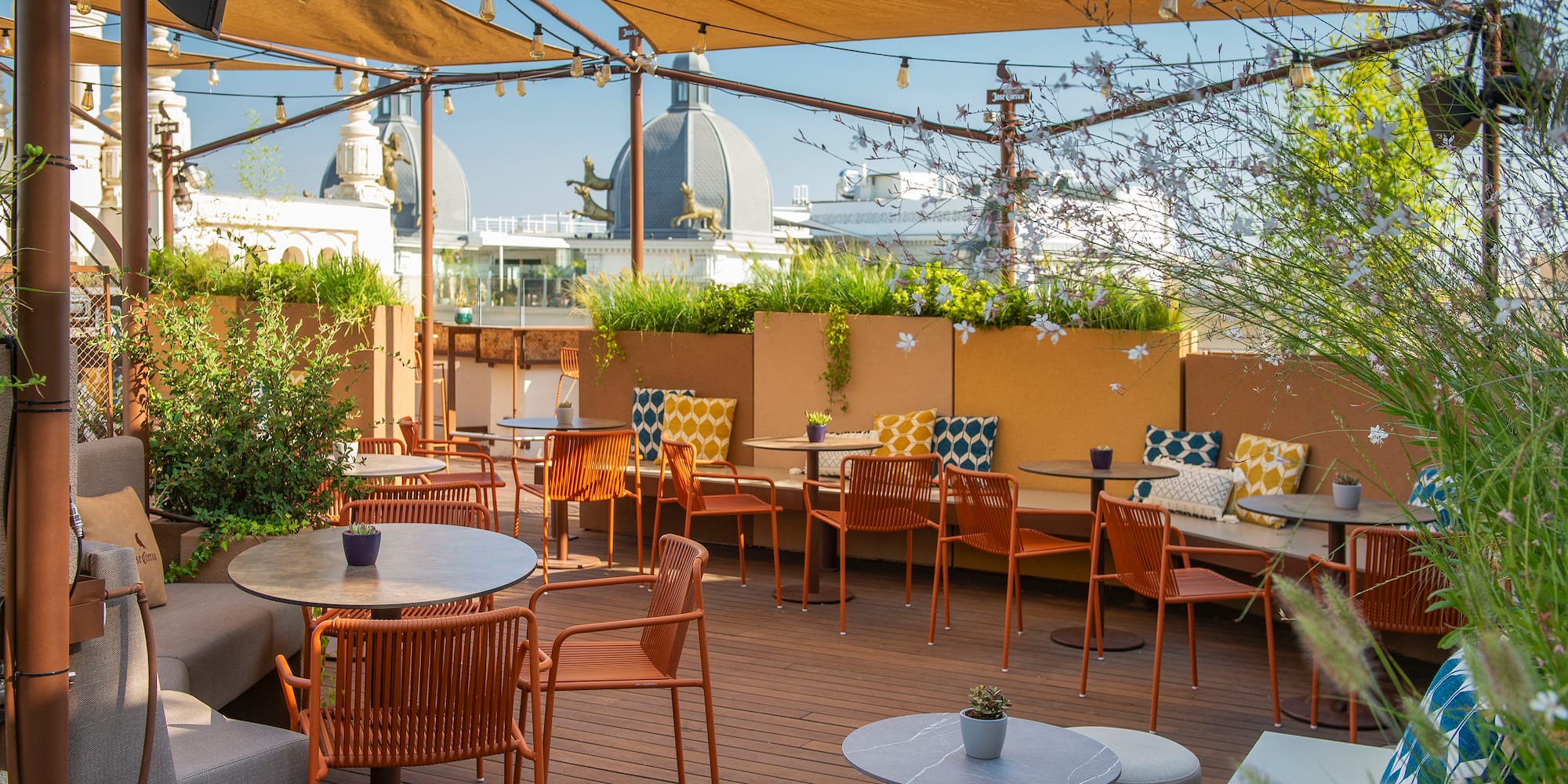 a patio with tables and chairs