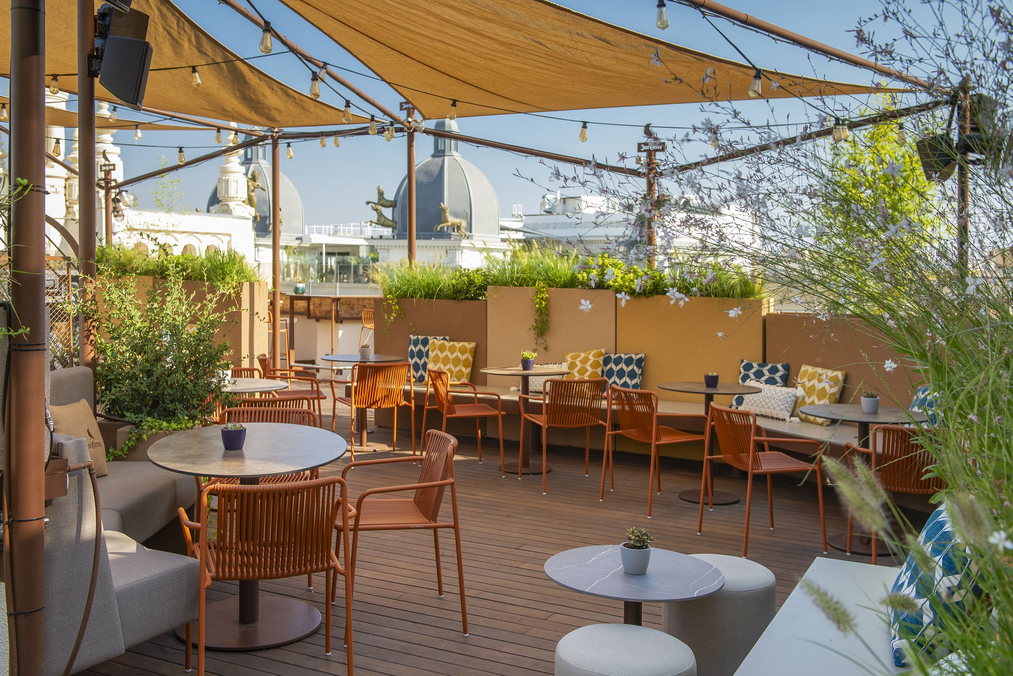 a patio with tables and chairs