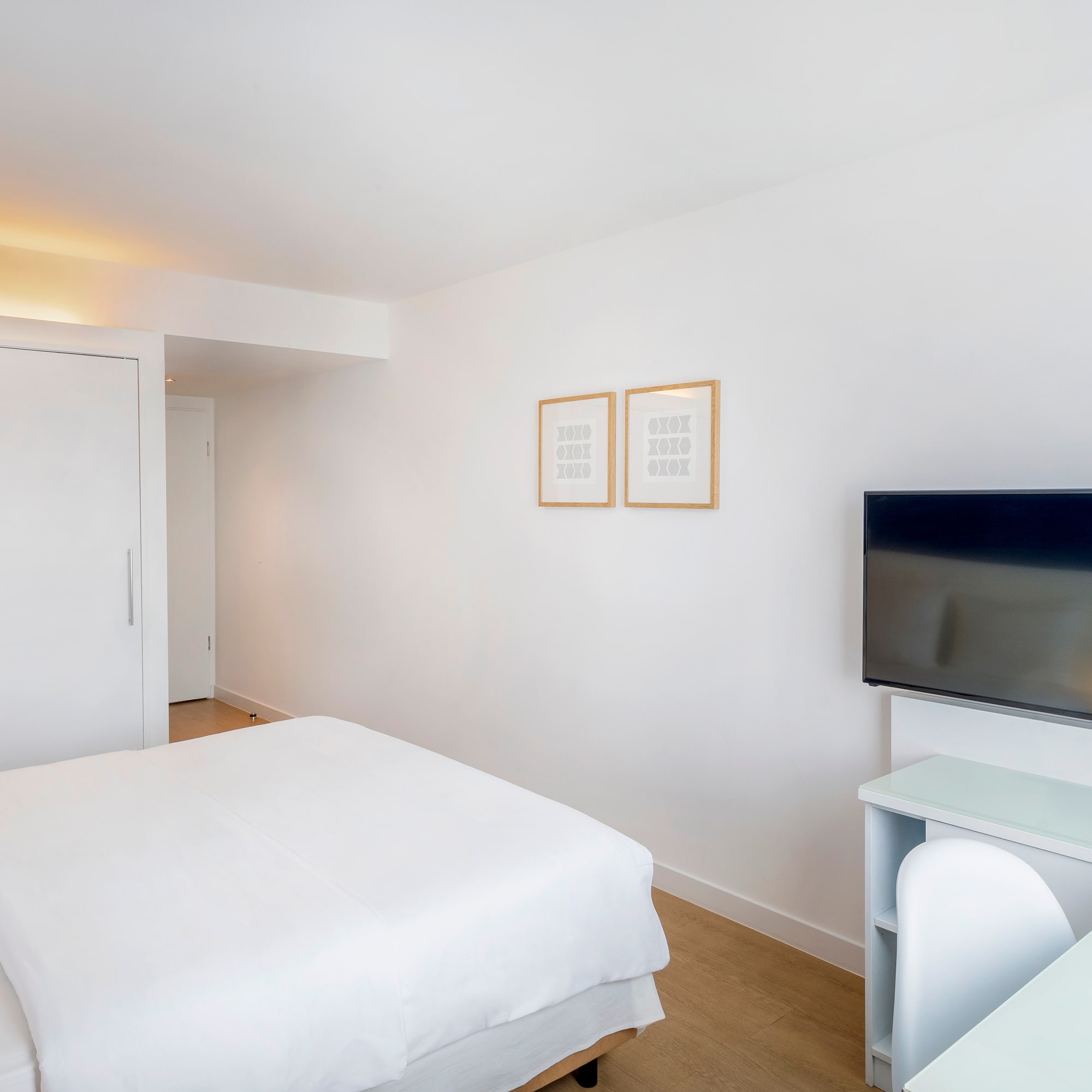 a room with a bed and a tv