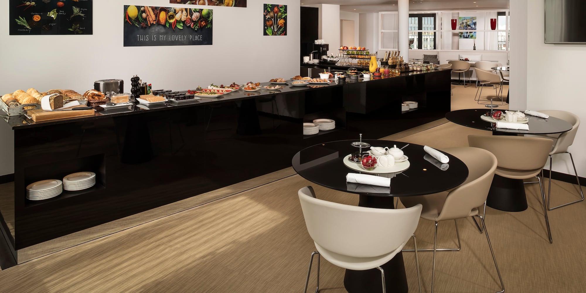 a room with a buffet table and chairs