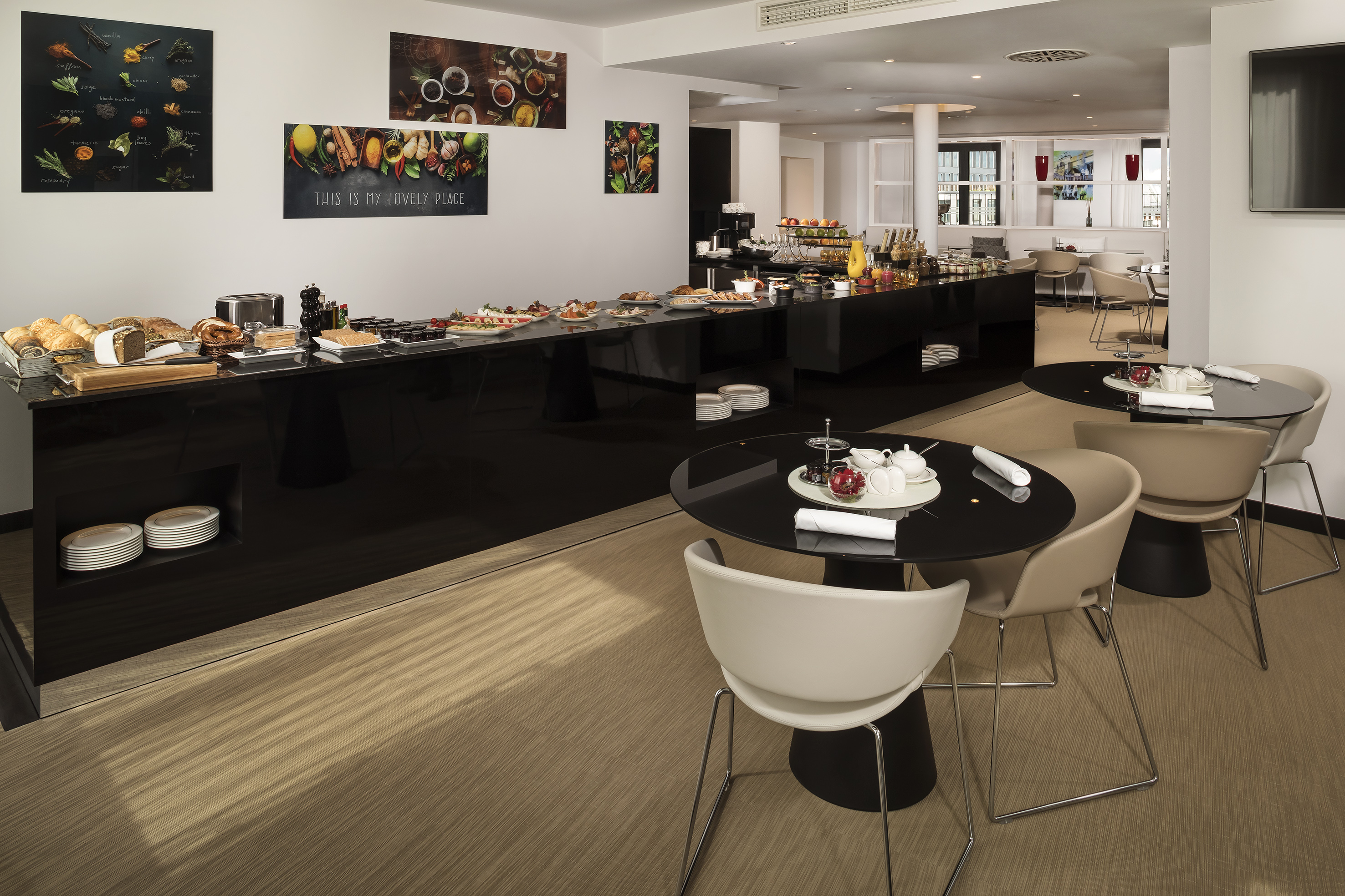 a room with a buffet table and chairs