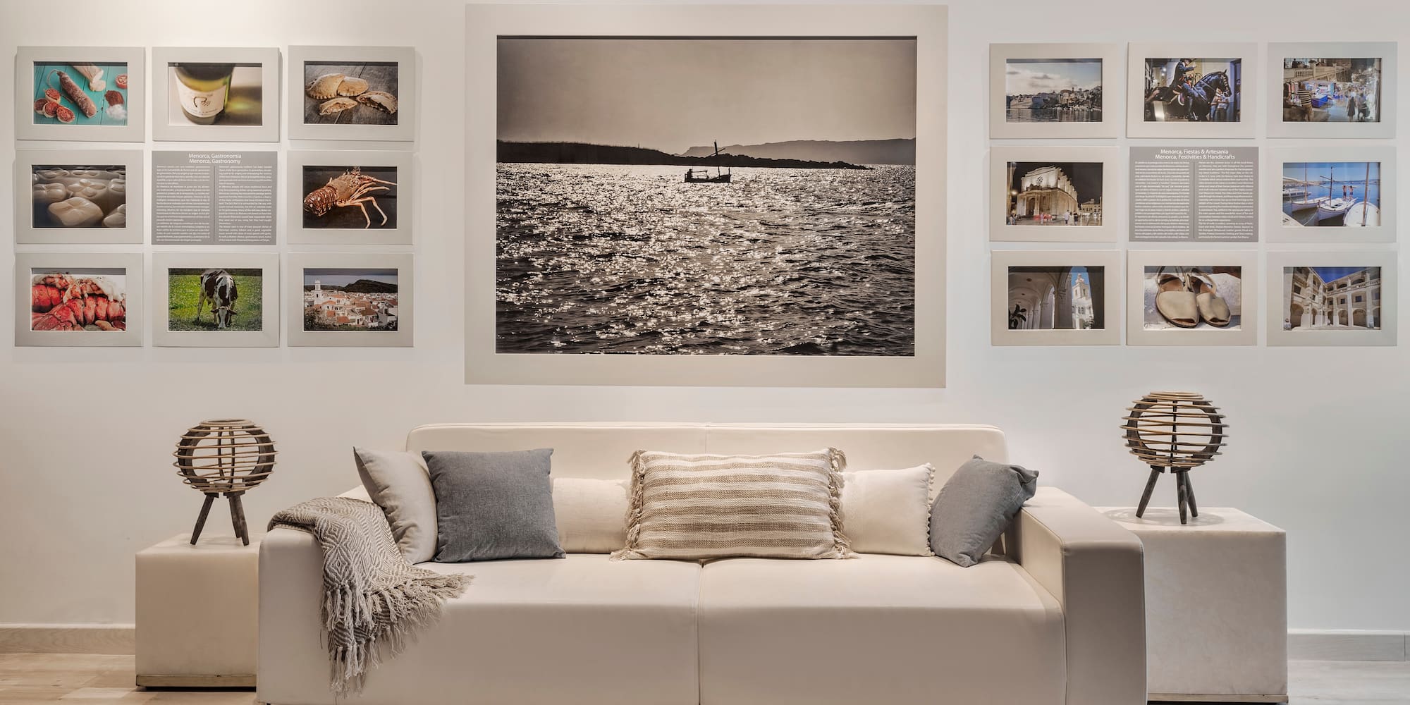 a couch with pillows and a picture on the wall