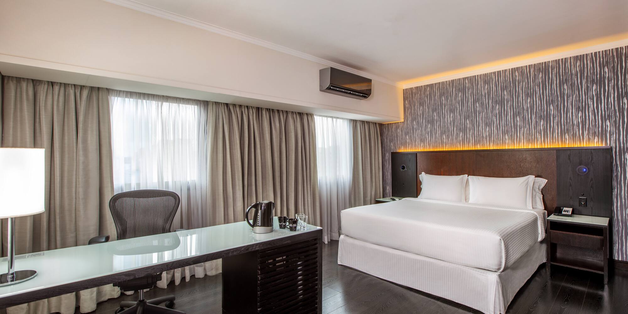 a room with a bed and a desk