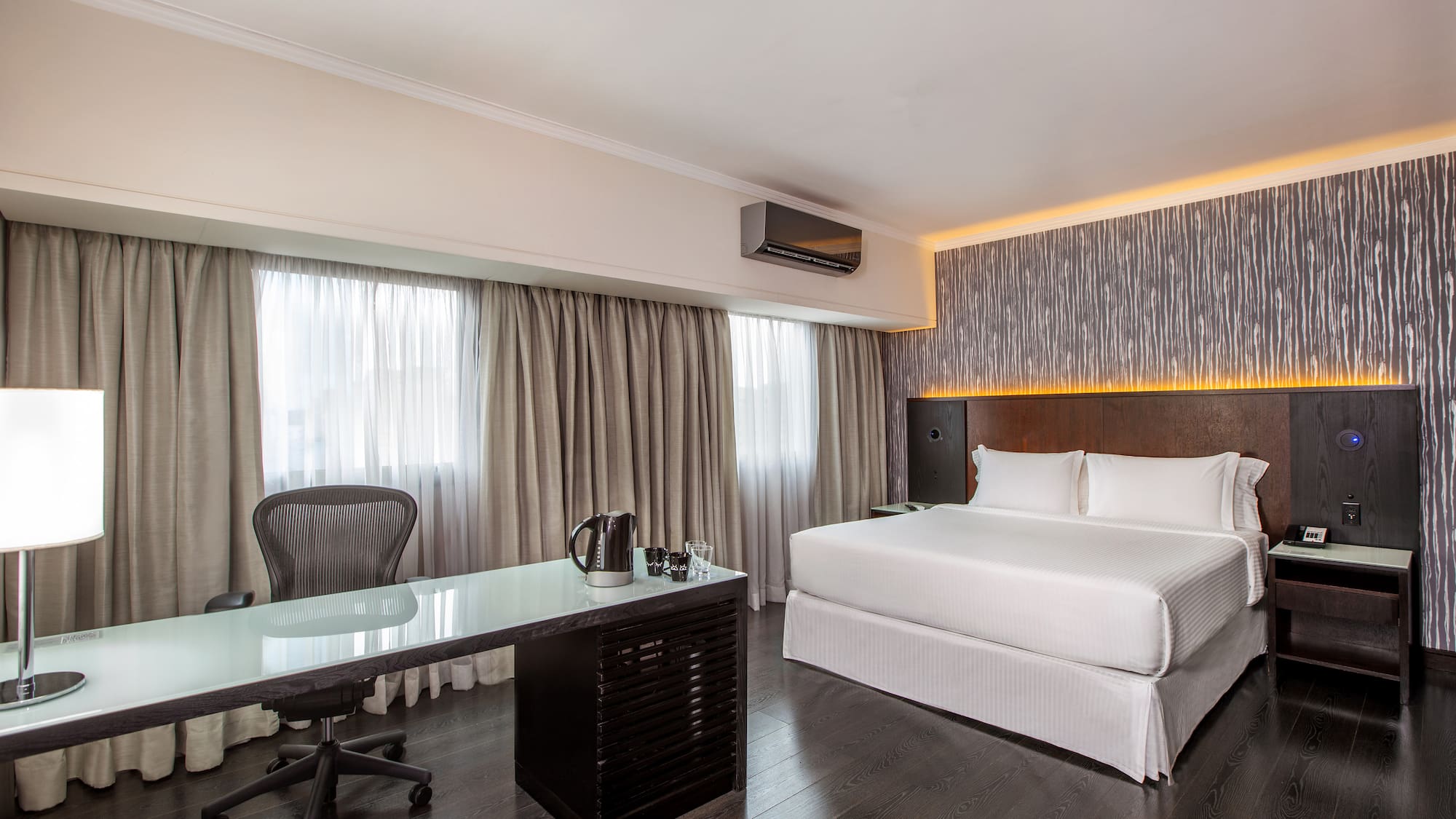 a room with a bed and a desk