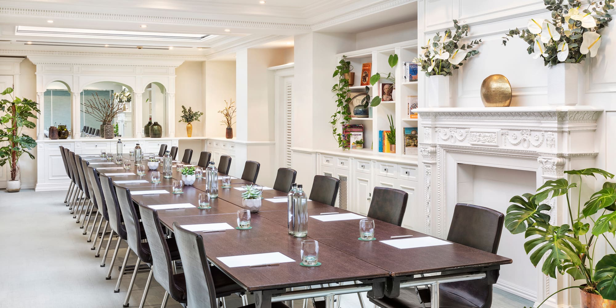a long conference room with a large table and chairs