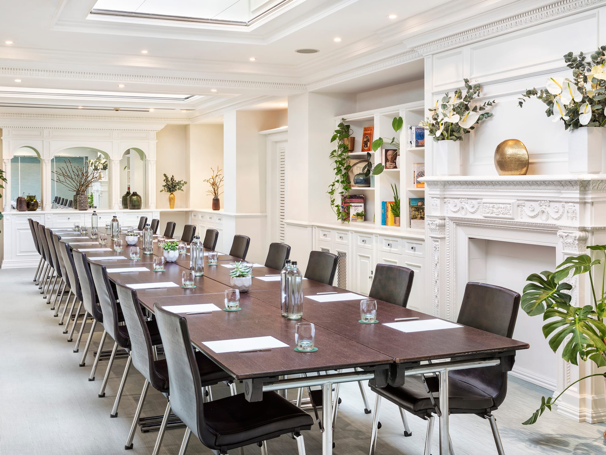 a long conference room with a large table and chairs