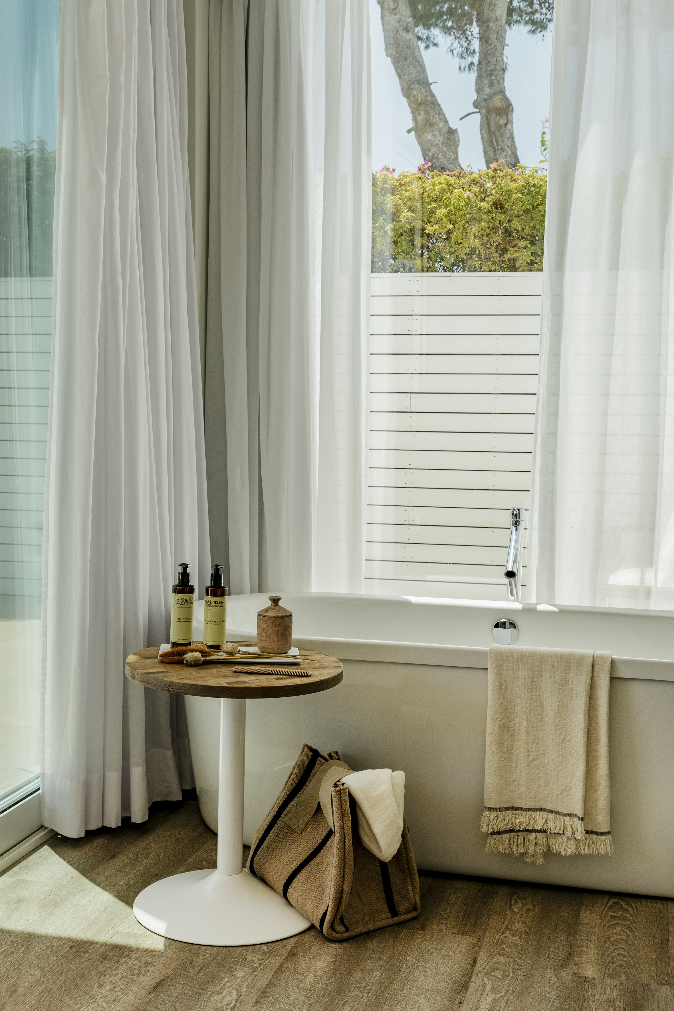 a bathroom with a tub and a table