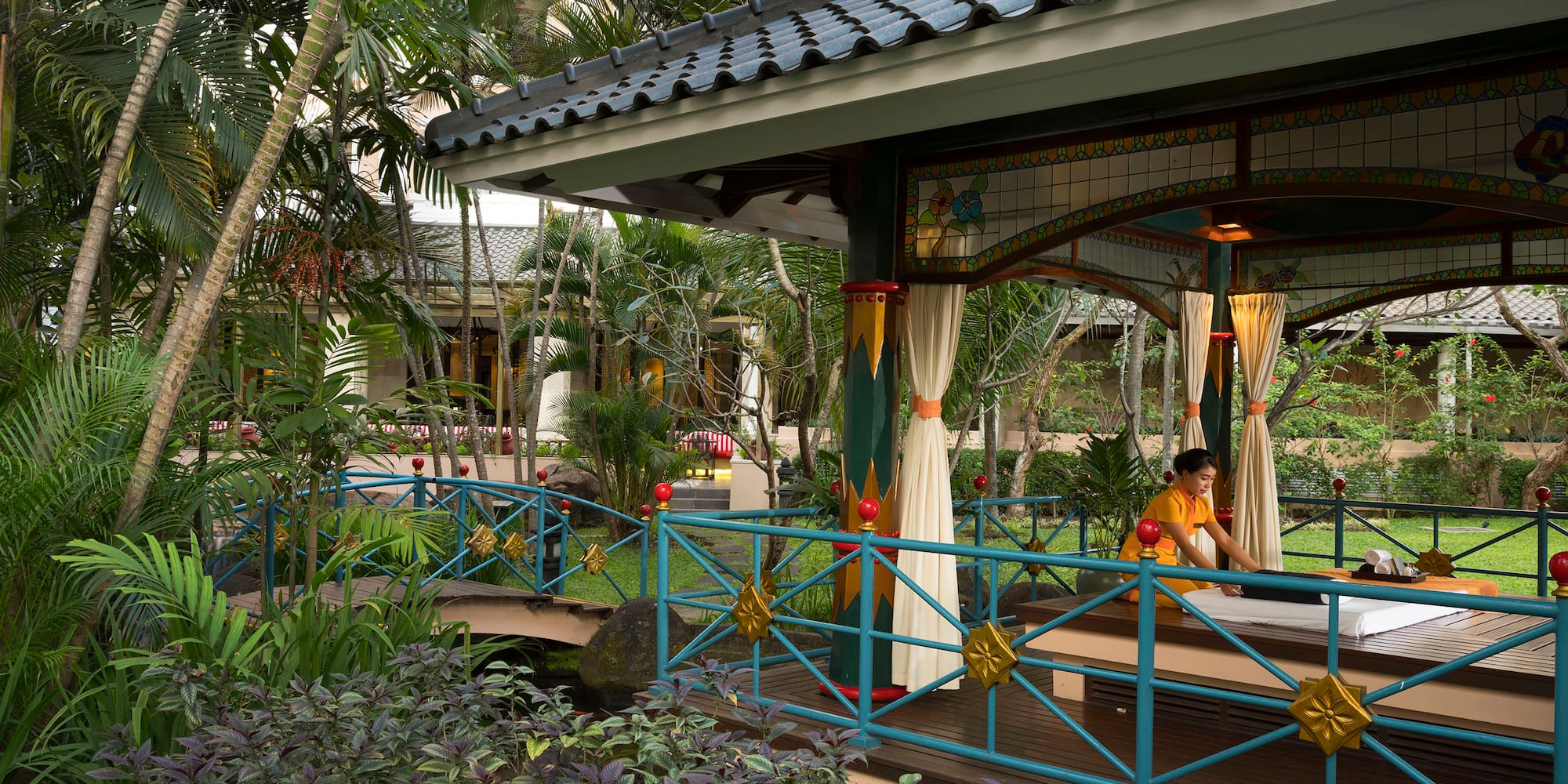 a person sitting on a bench outside