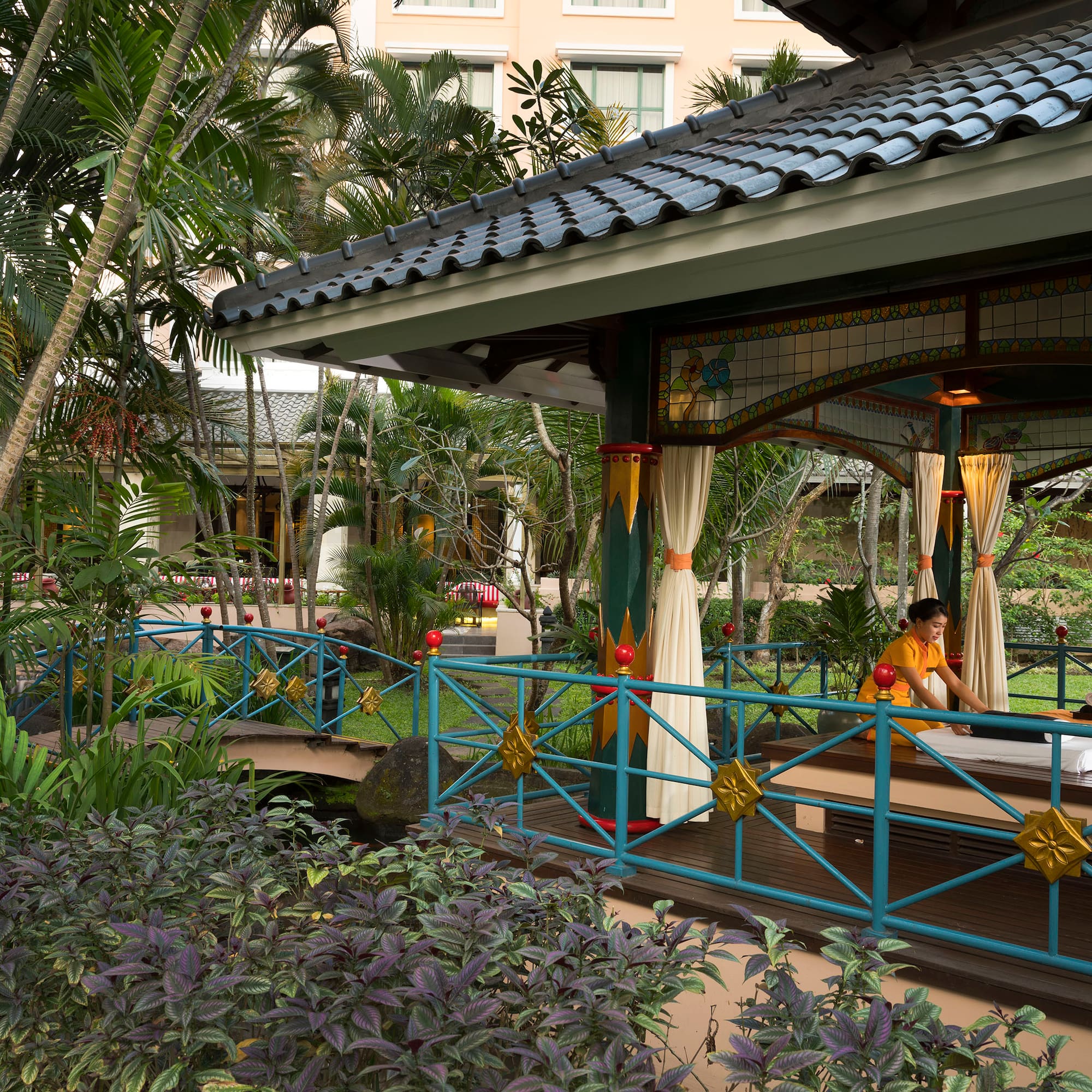 a person sitting on a bench outside