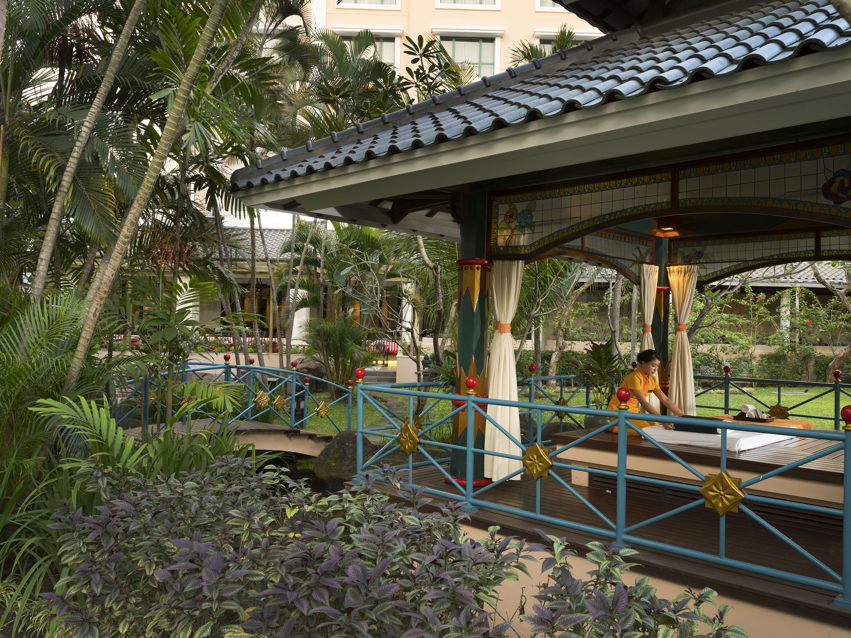 a person sitting on a bench outside