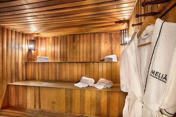 a wooden sauna with white towels
