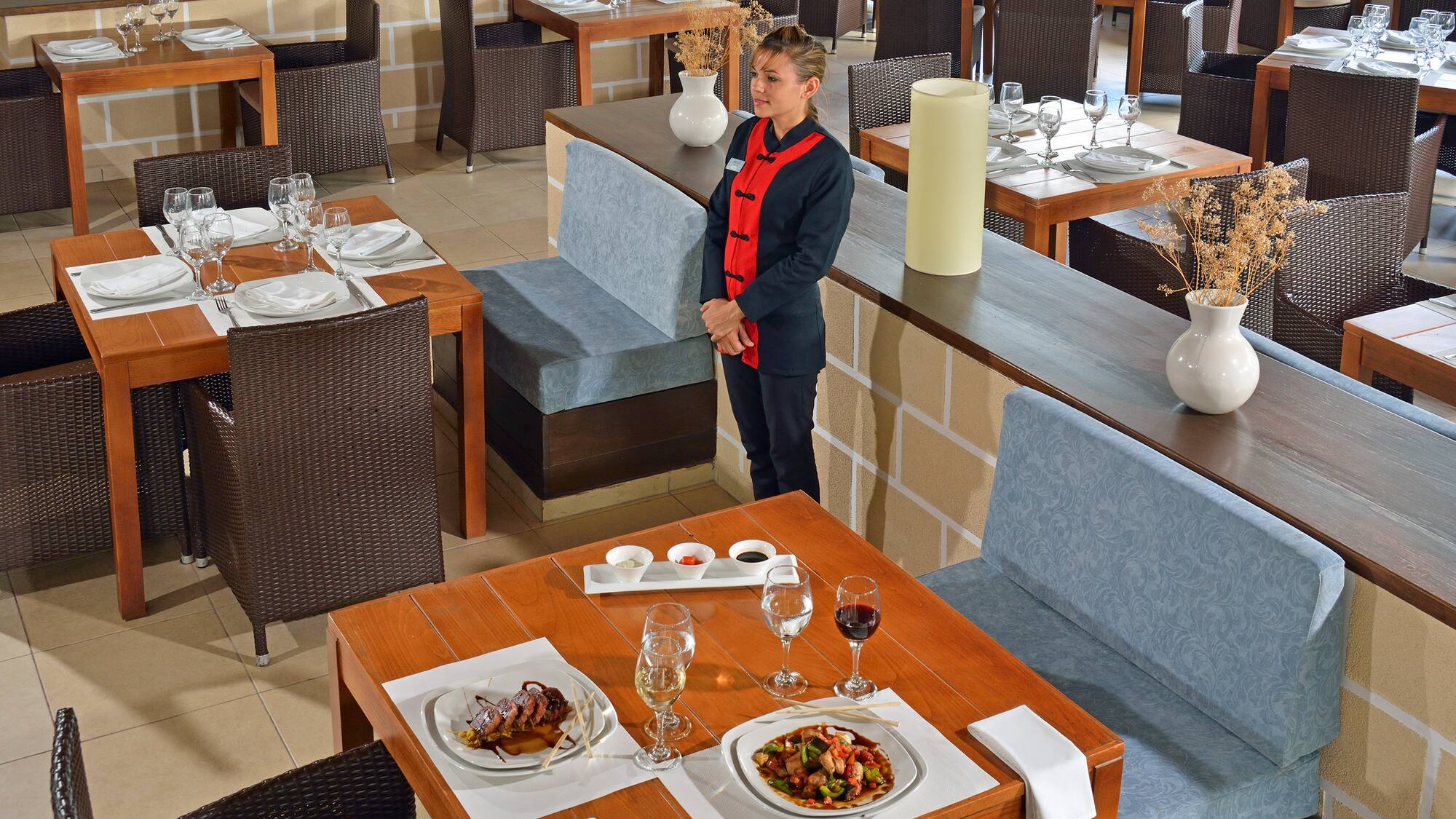 a woman standing in a restaurant