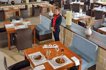 a woman standing in a restaurant