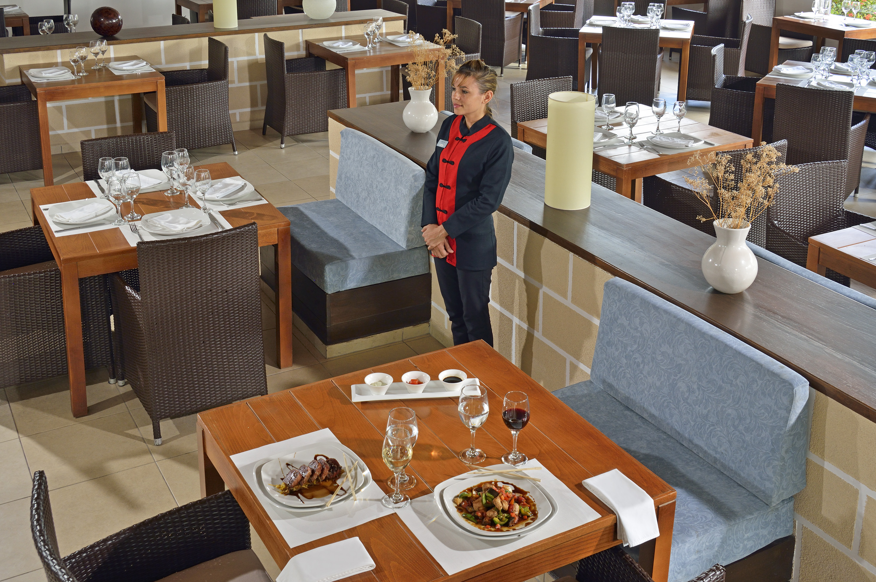 a woman standing in a restaurant