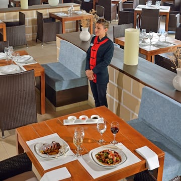 a woman standing in a restaurant