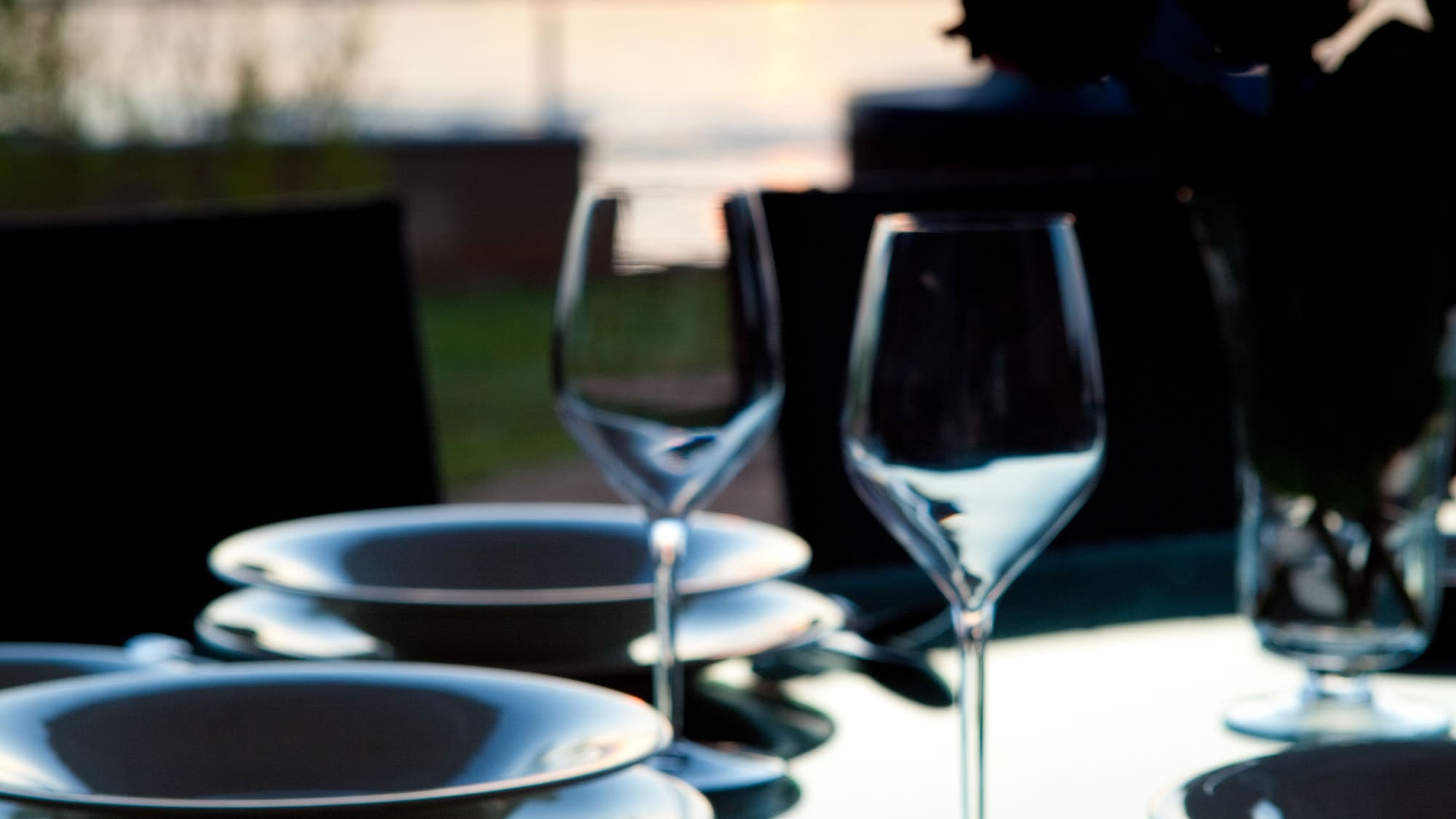 a table with plates and wine glasses on it