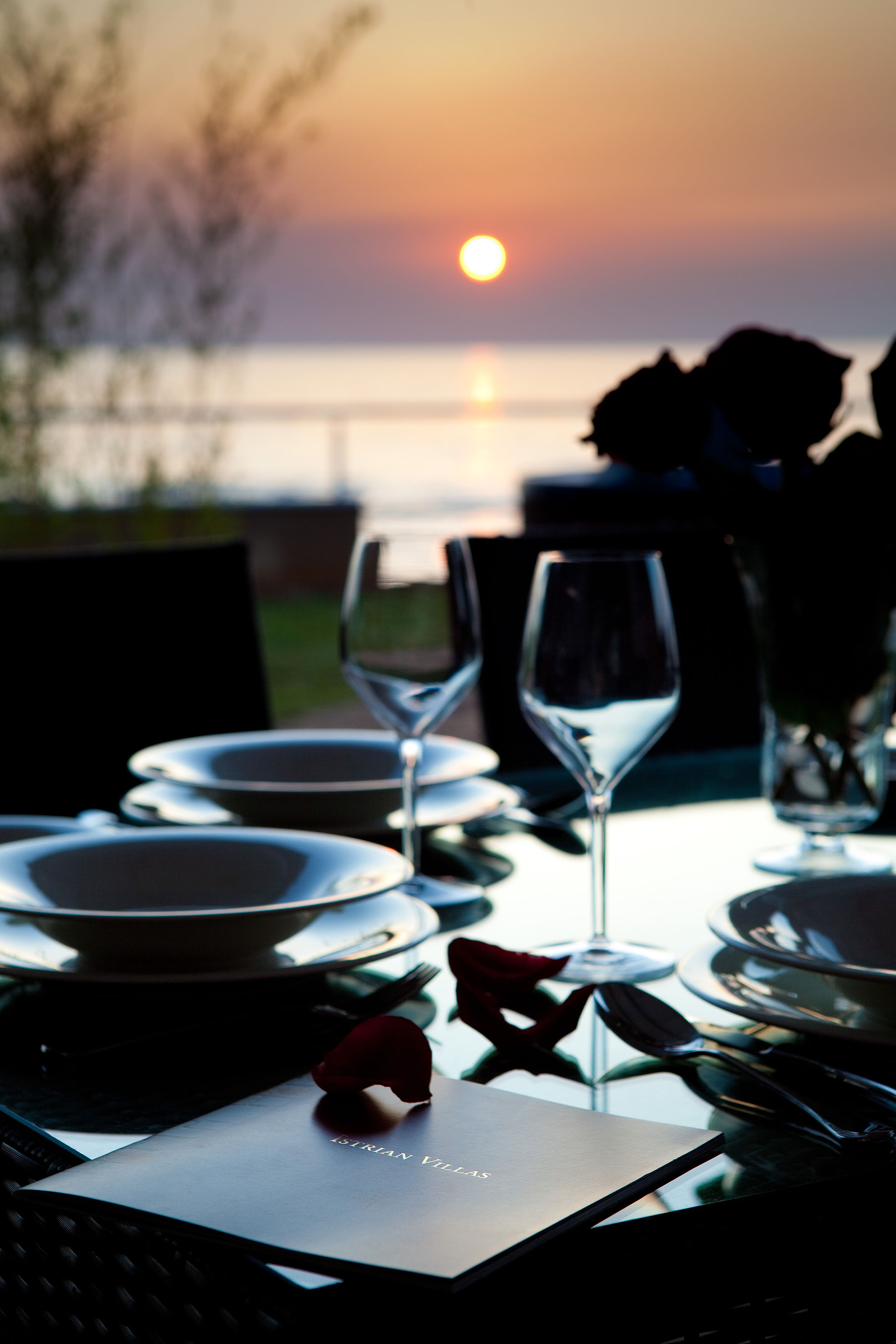 a table with plates and wine glasses on it