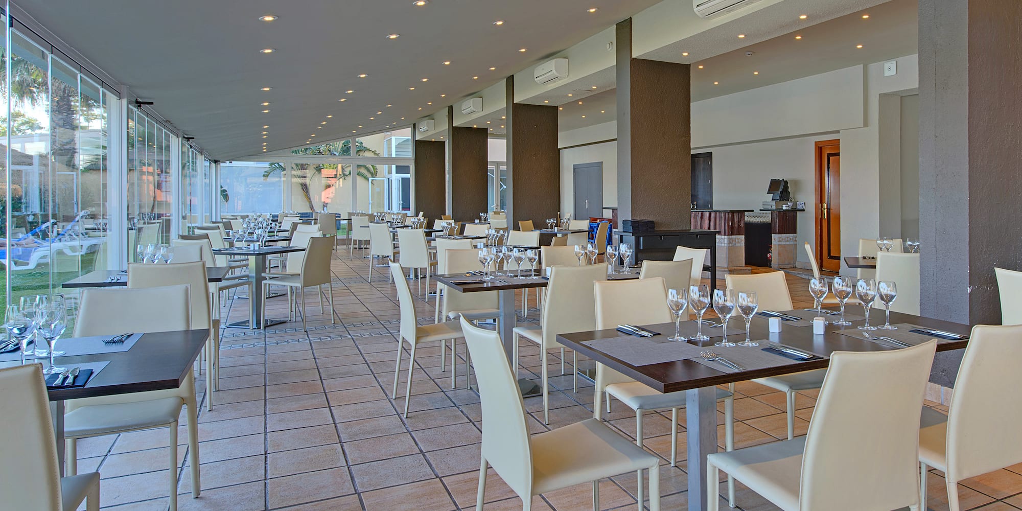 a restaurant with tables and chairs