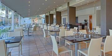 a restaurant with tables and chairs