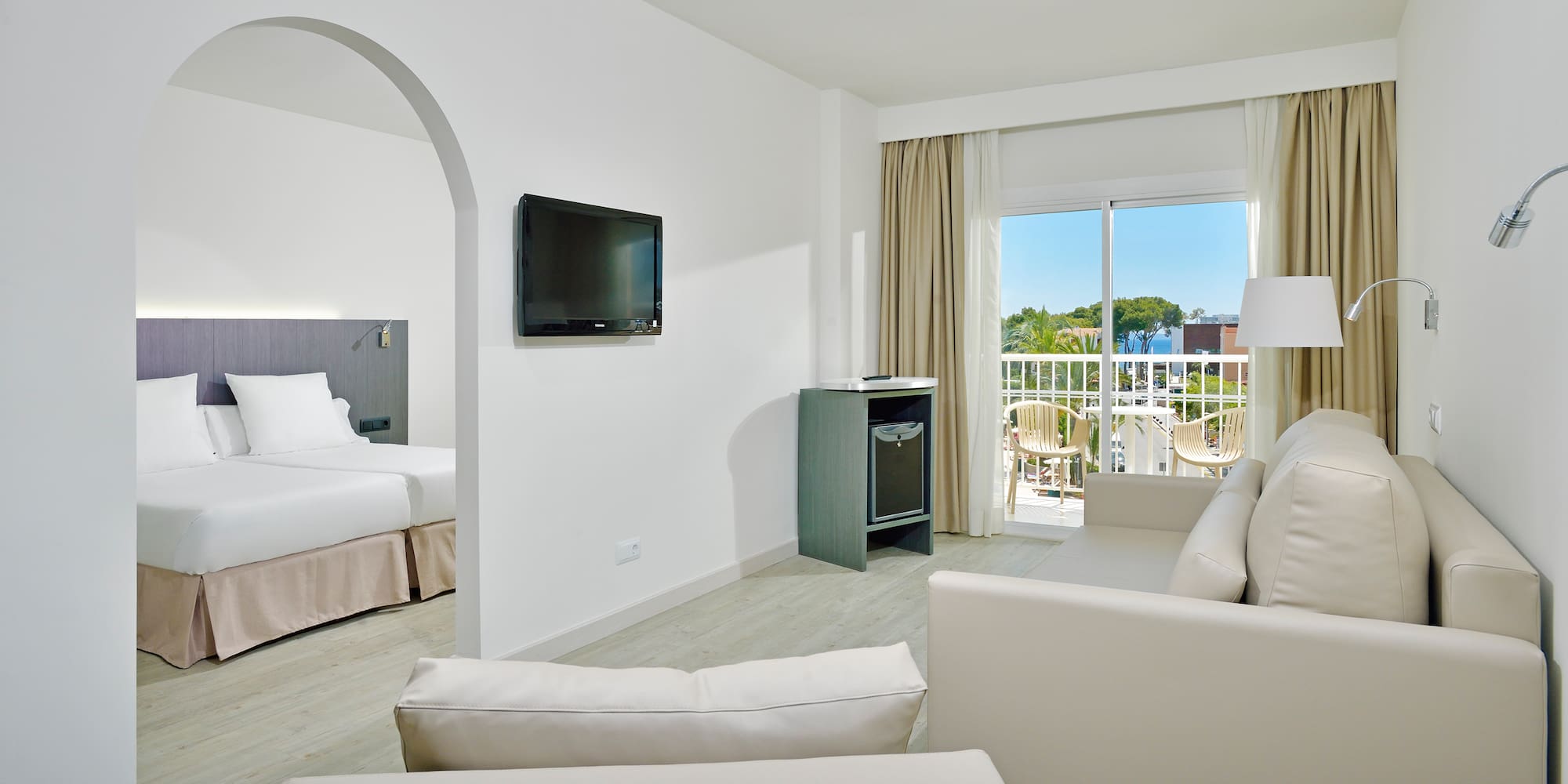 a room with a television and a television on the wall