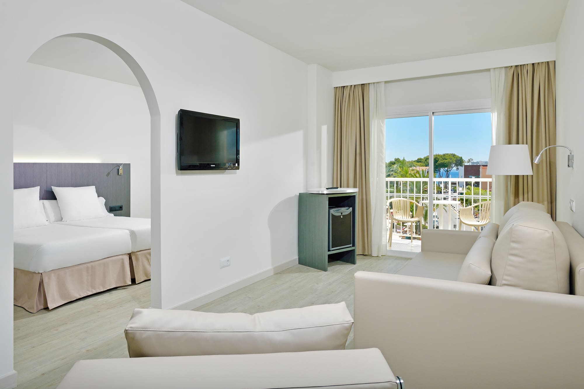 a room with a television and a television on the wall