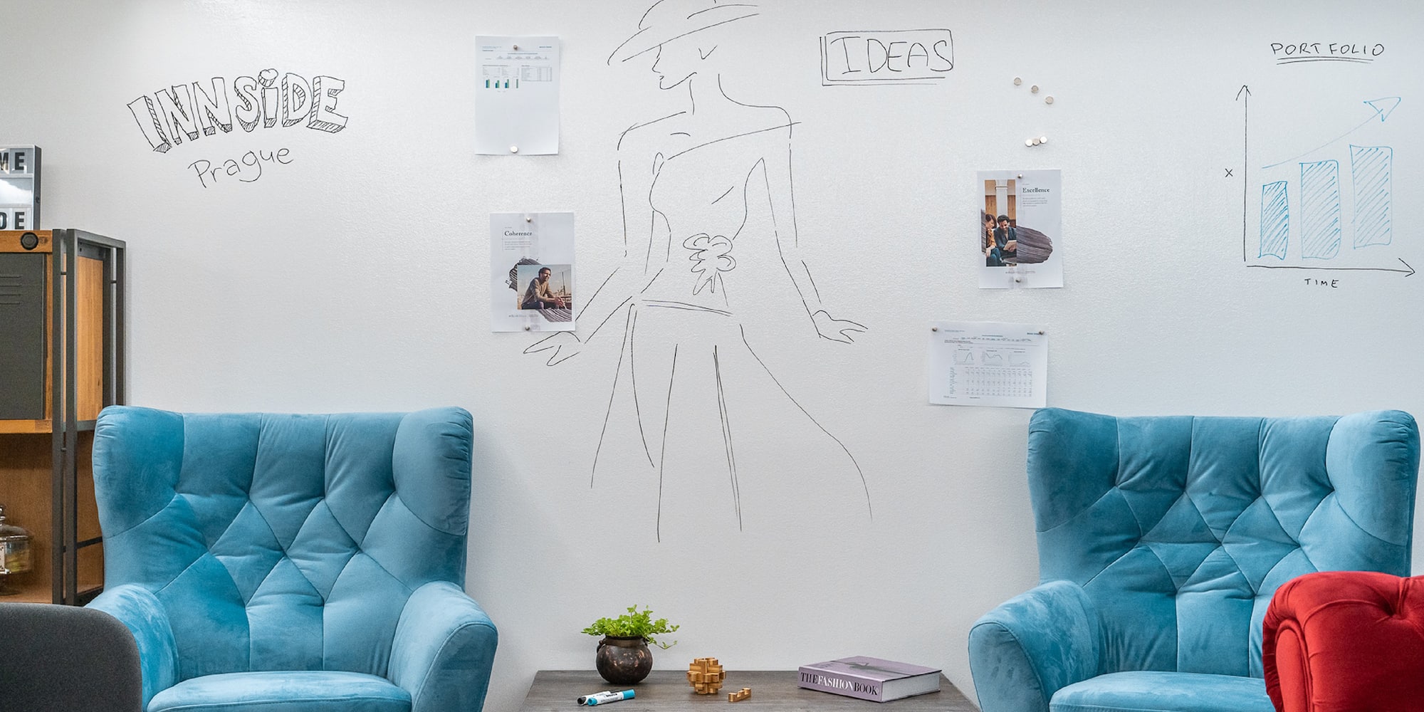 a room with blue chairs and a coffee table