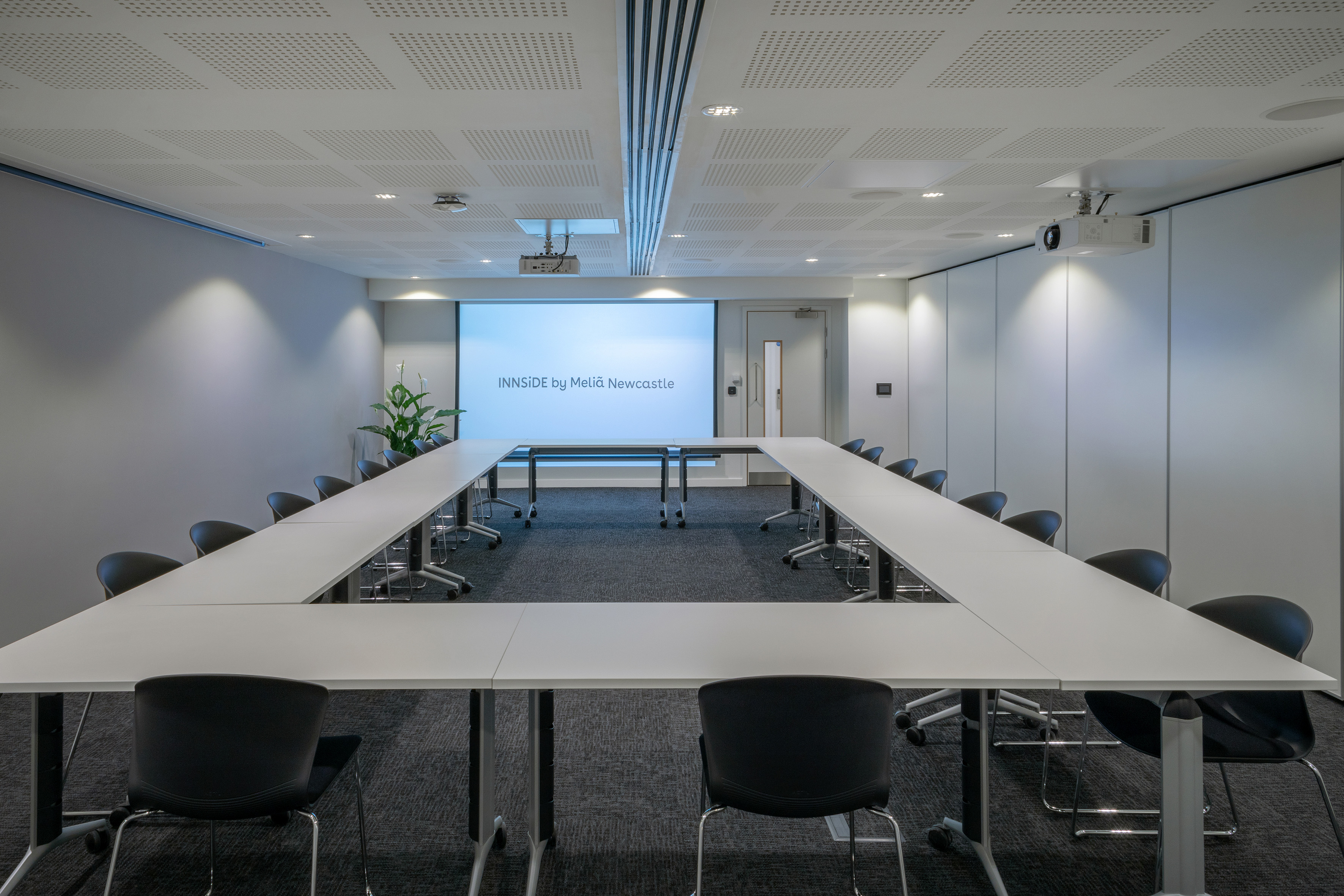 a conference room with a projection screen