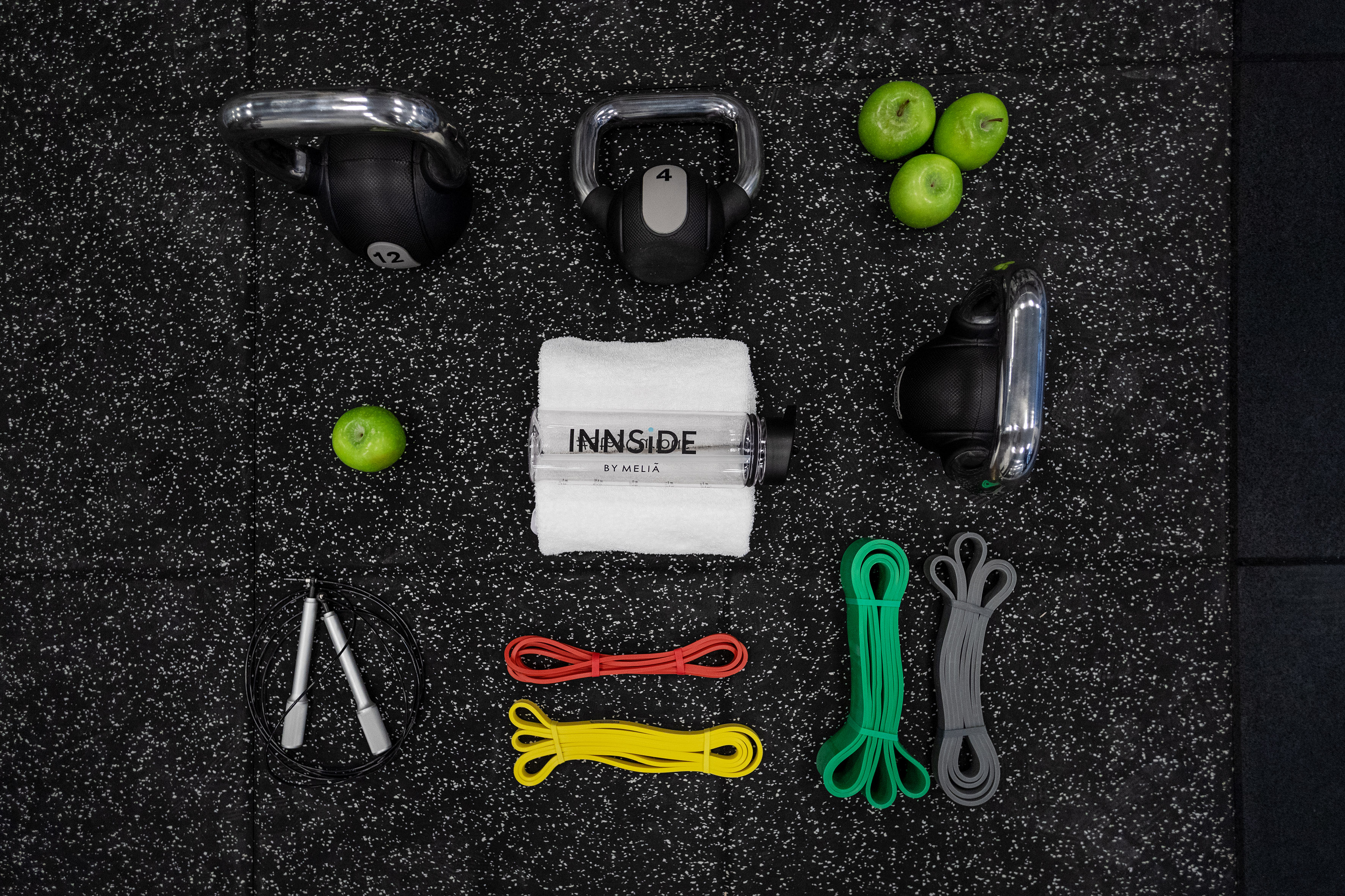 INNSIDE by MELIA fitness kit with kettlebells, resistance bands, jump rope, and apples.