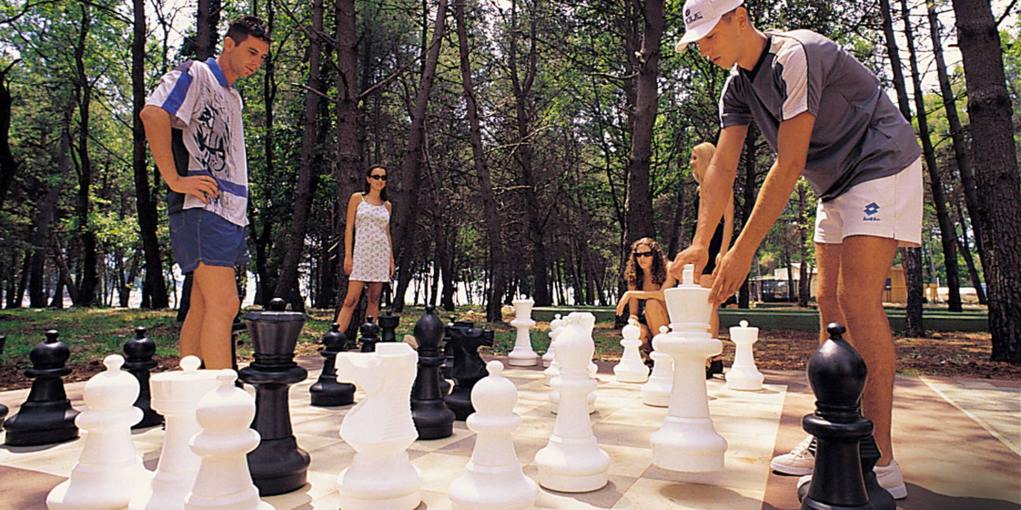 a group of people playing chess