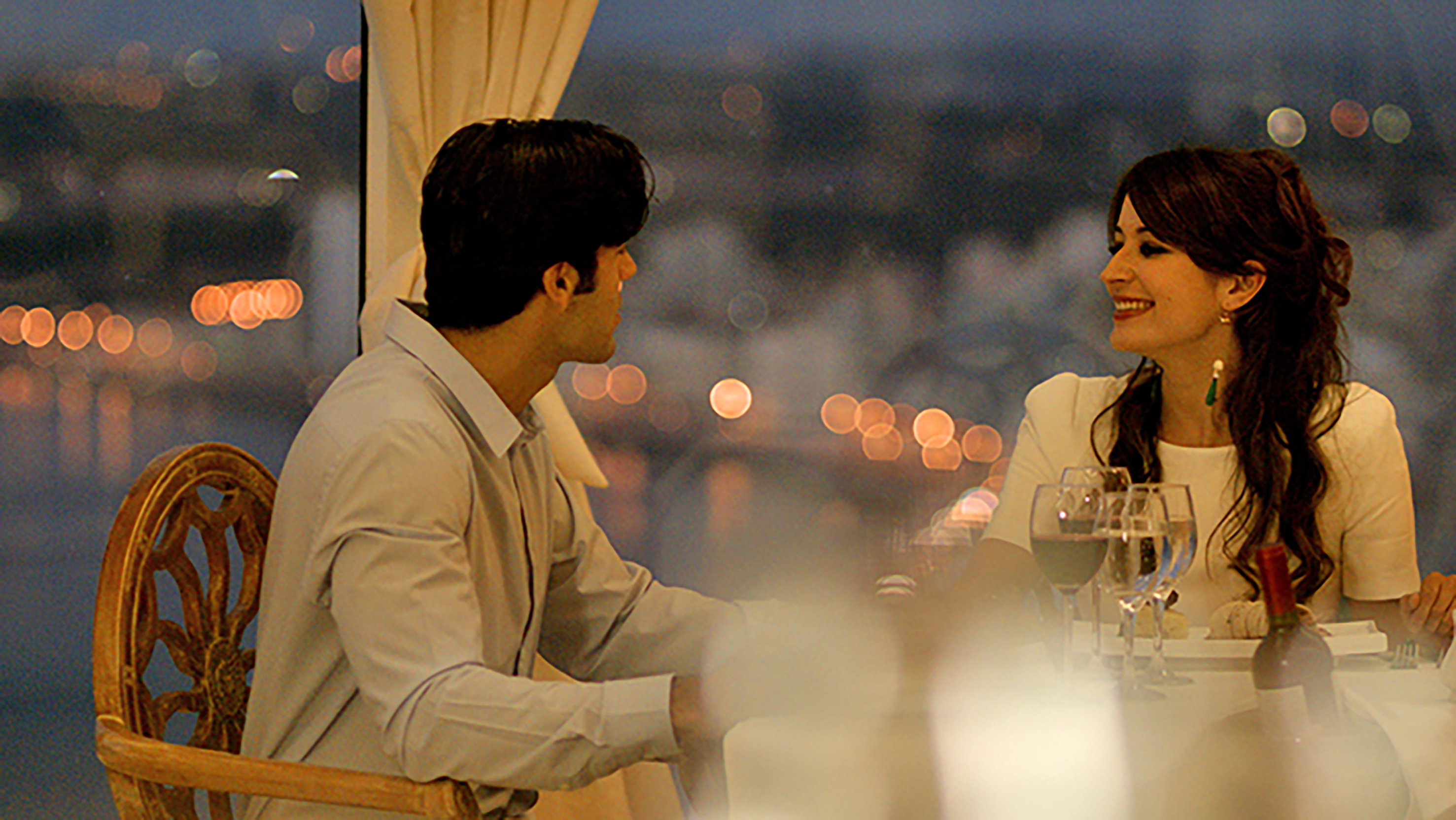 a man and woman sitting at a table