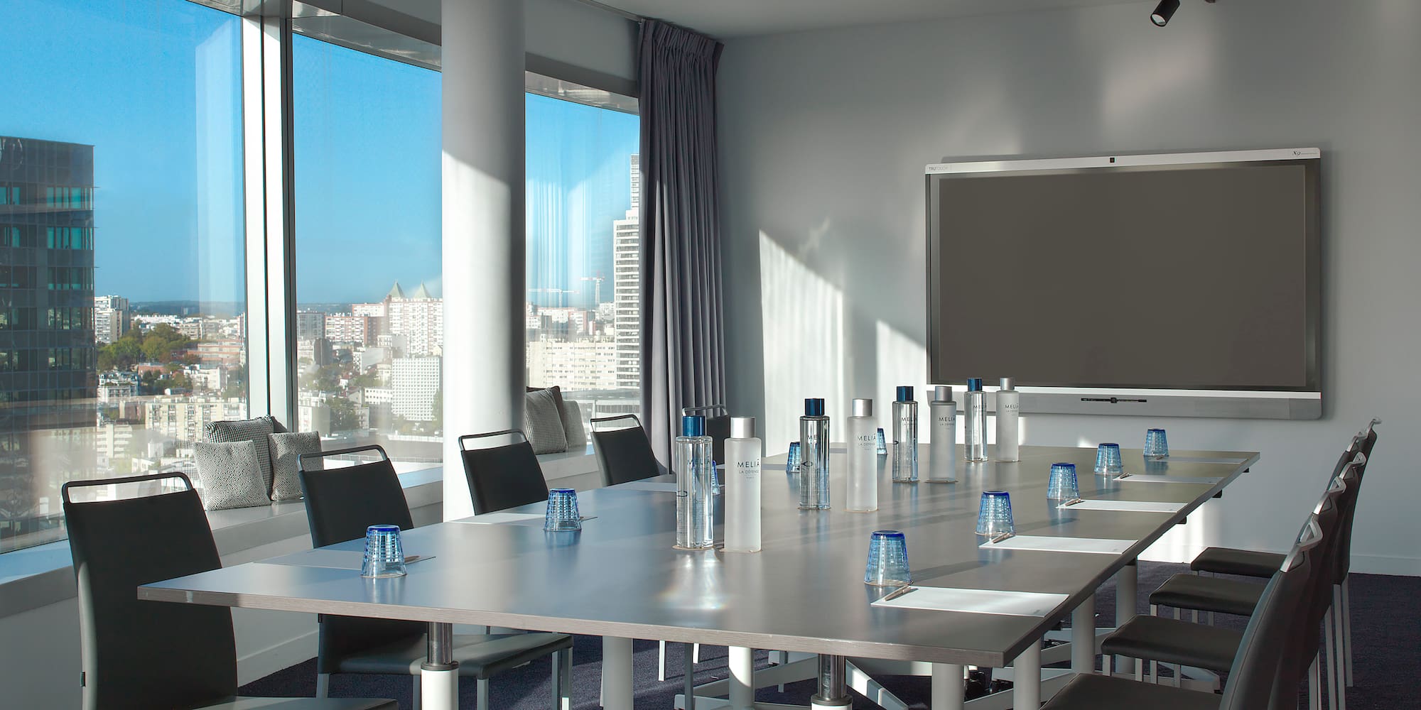 a room with a large table and chairs