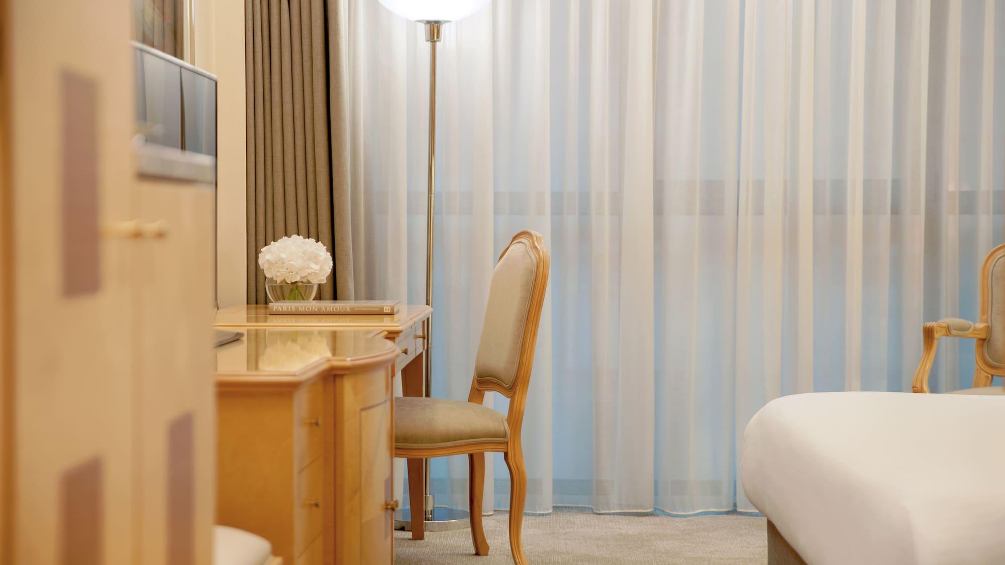 a desk and chair in a hotel room