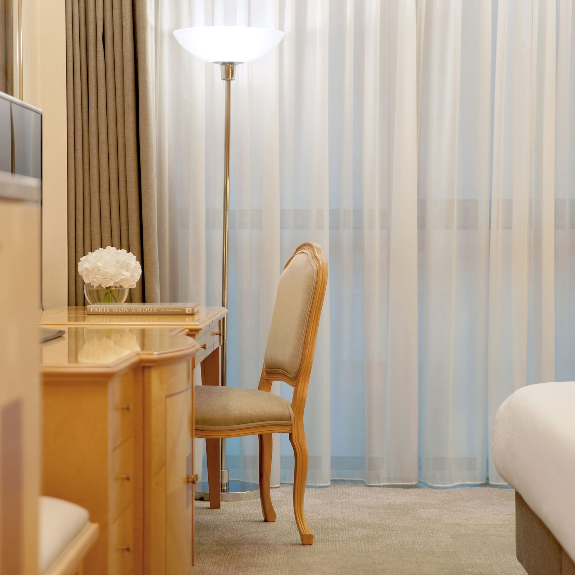 a desk and chair in a hotel room