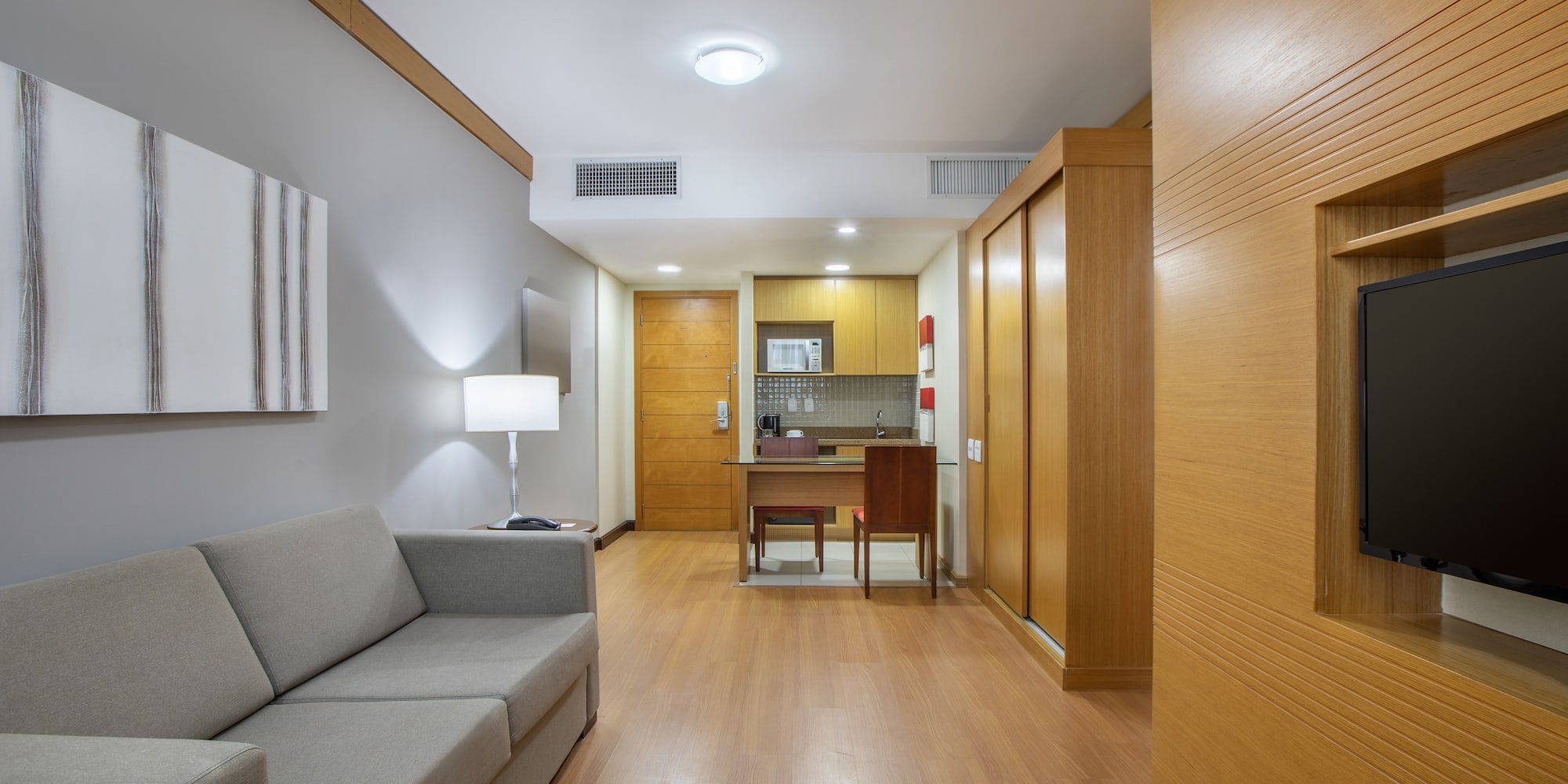 a room with a couch and a desk