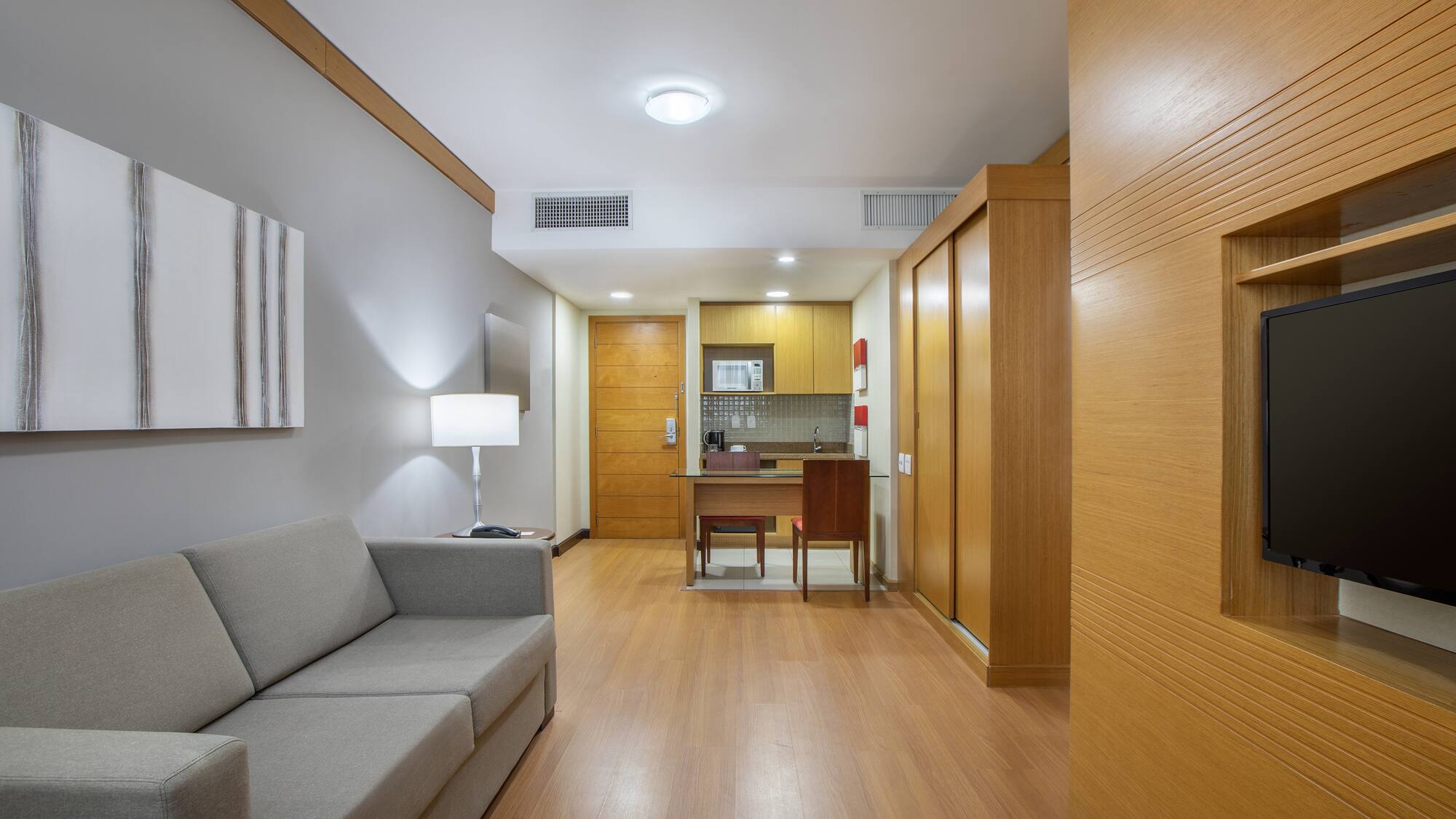 a room with a couch and a desk