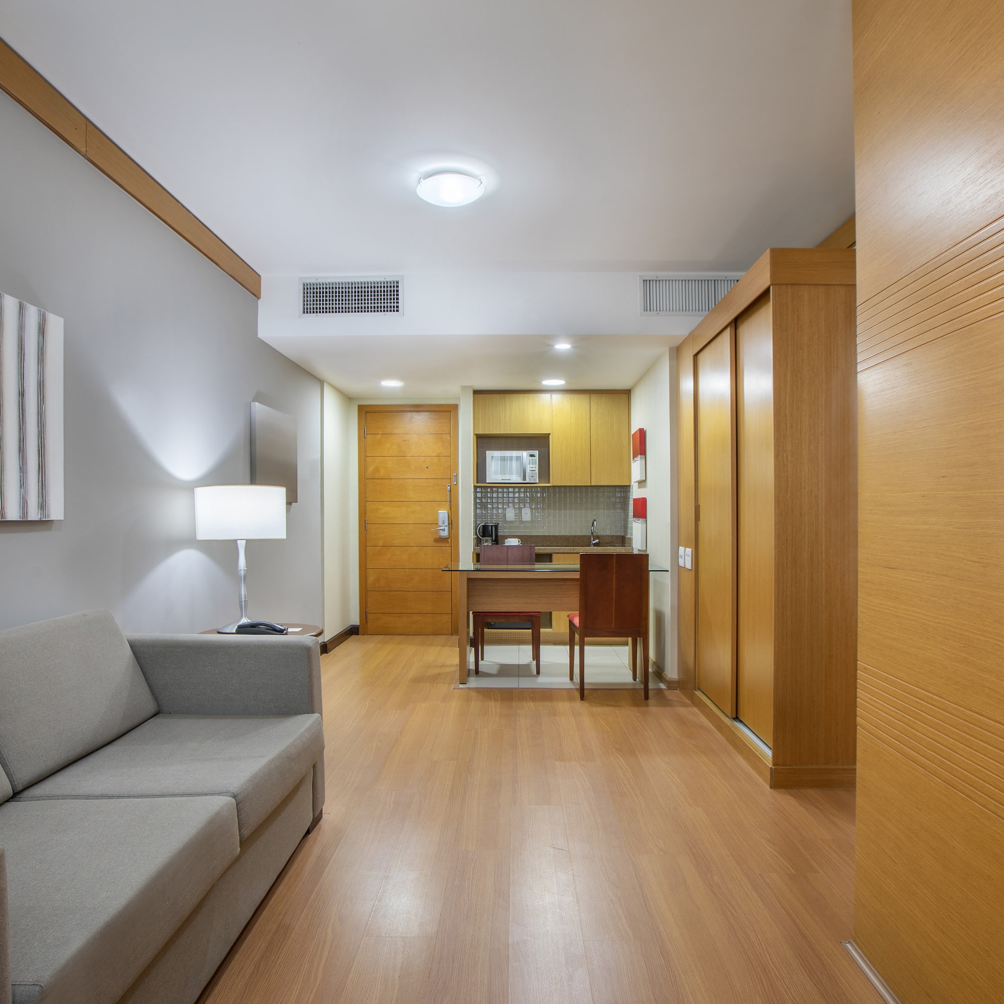 a room with a couch and a desk