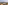 Outdoor dining set for two overlooking volcanic mountains and a city.