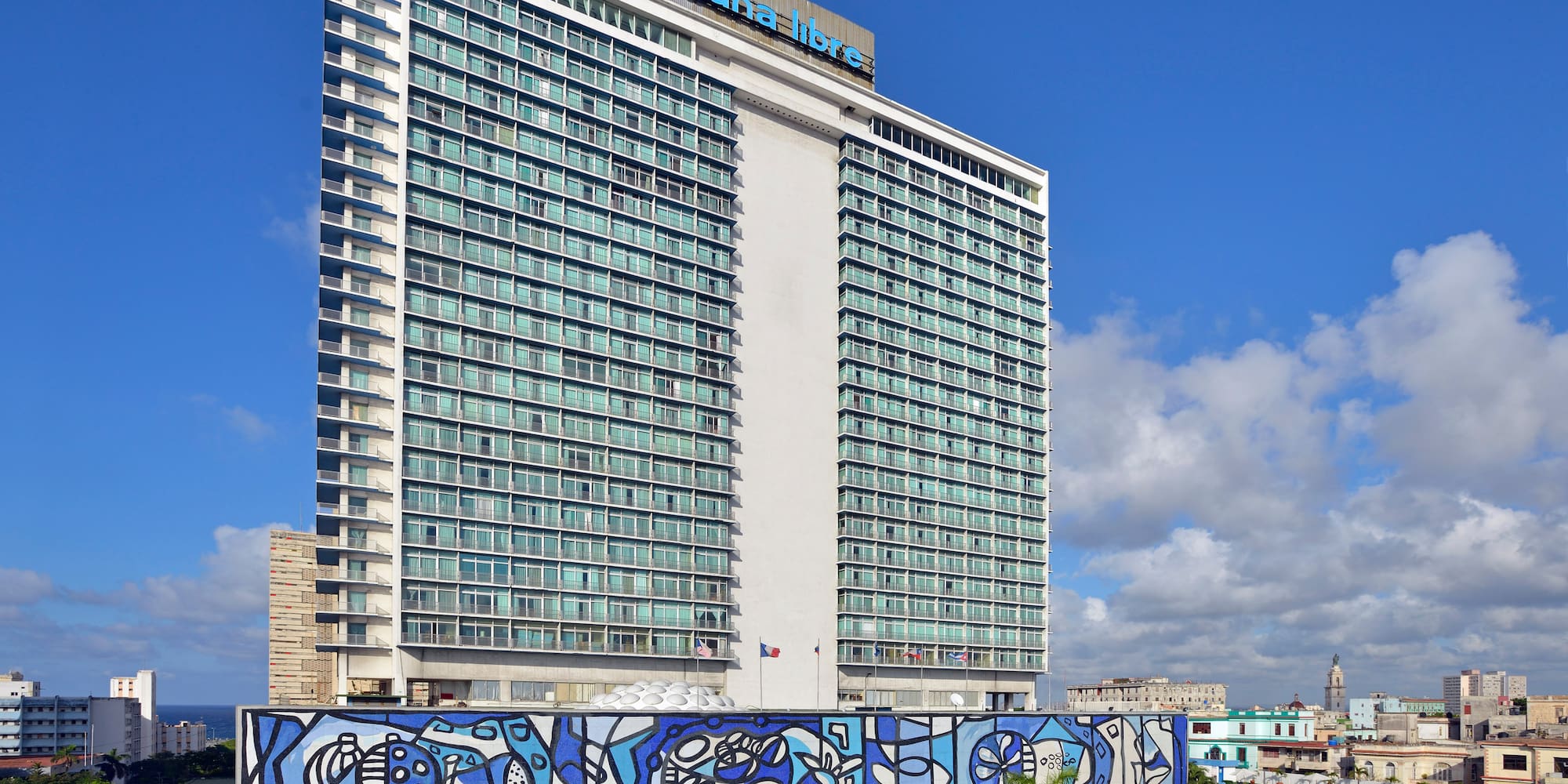 a large building with a blue mural on the side