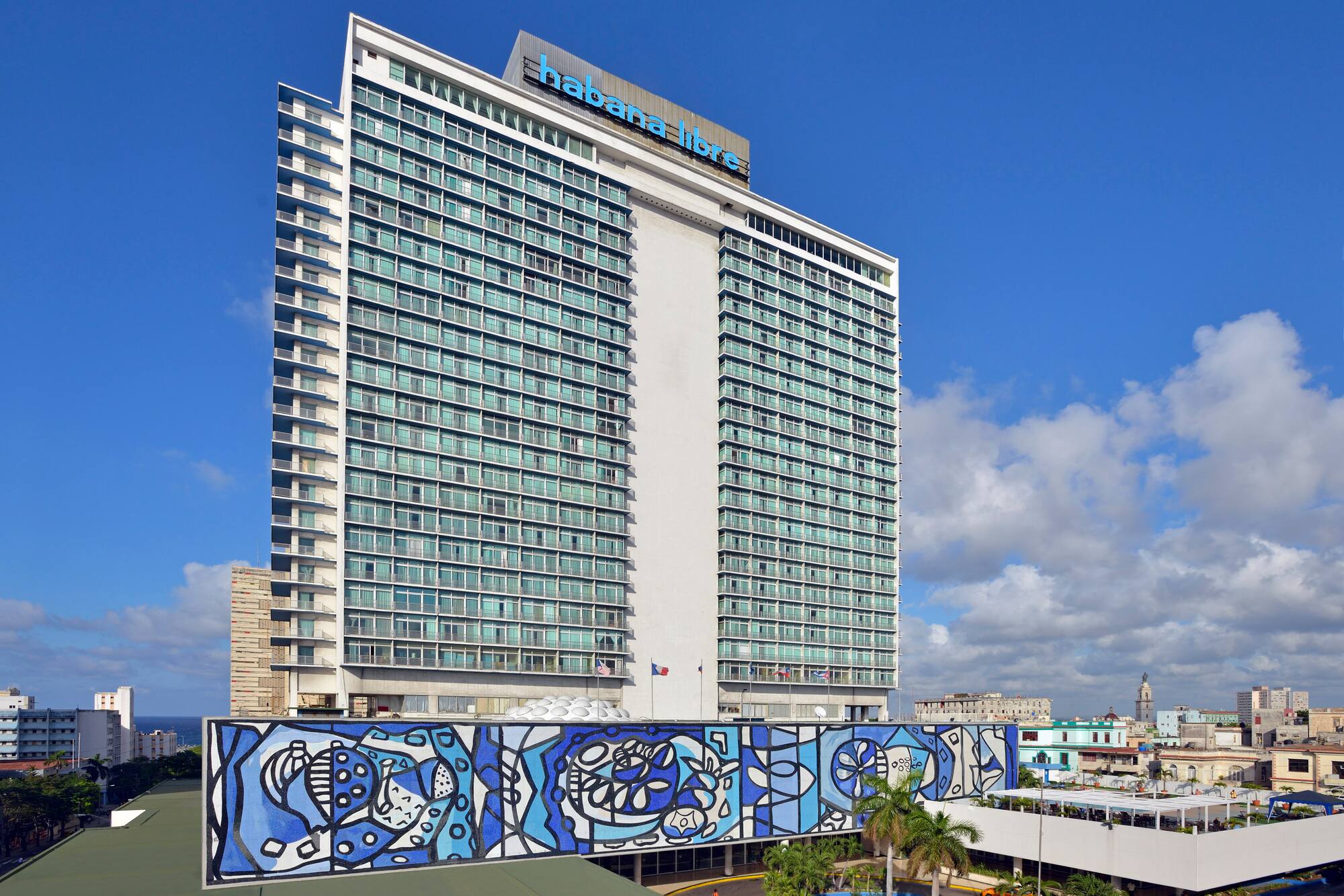 a large building with a blue mural on the side