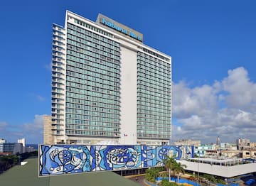 a large building with a blue mural on the side