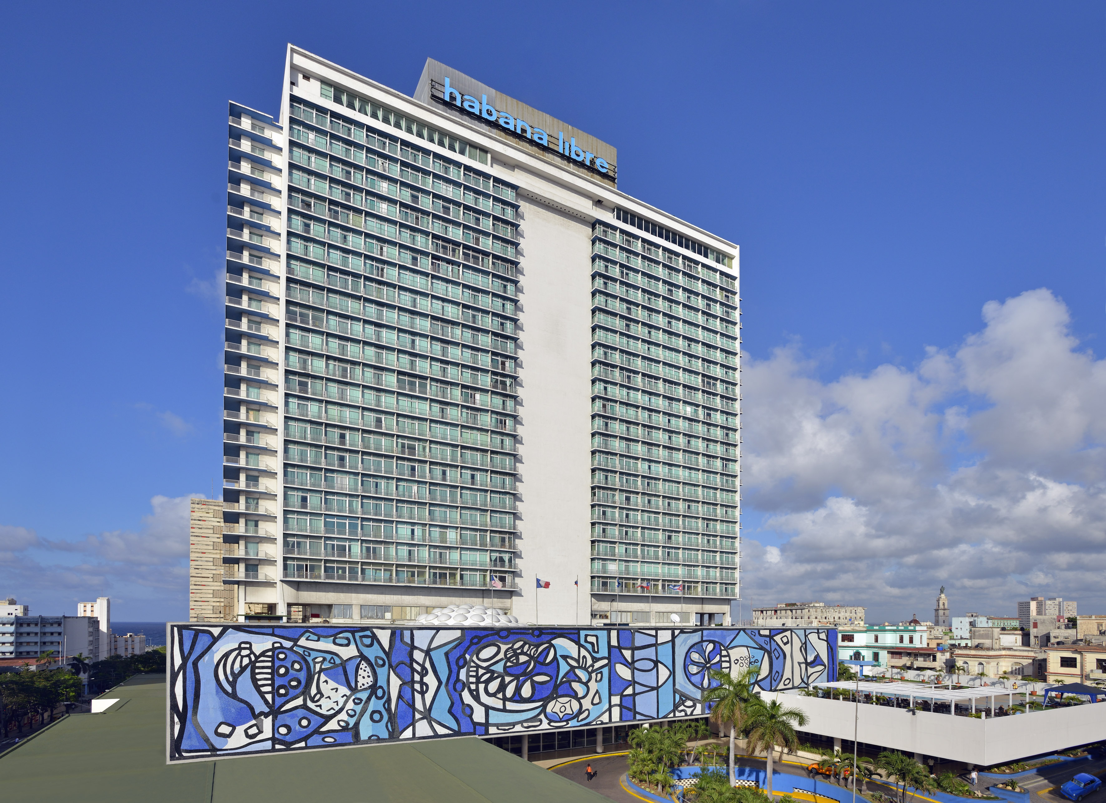a large building with a blue mural on the side