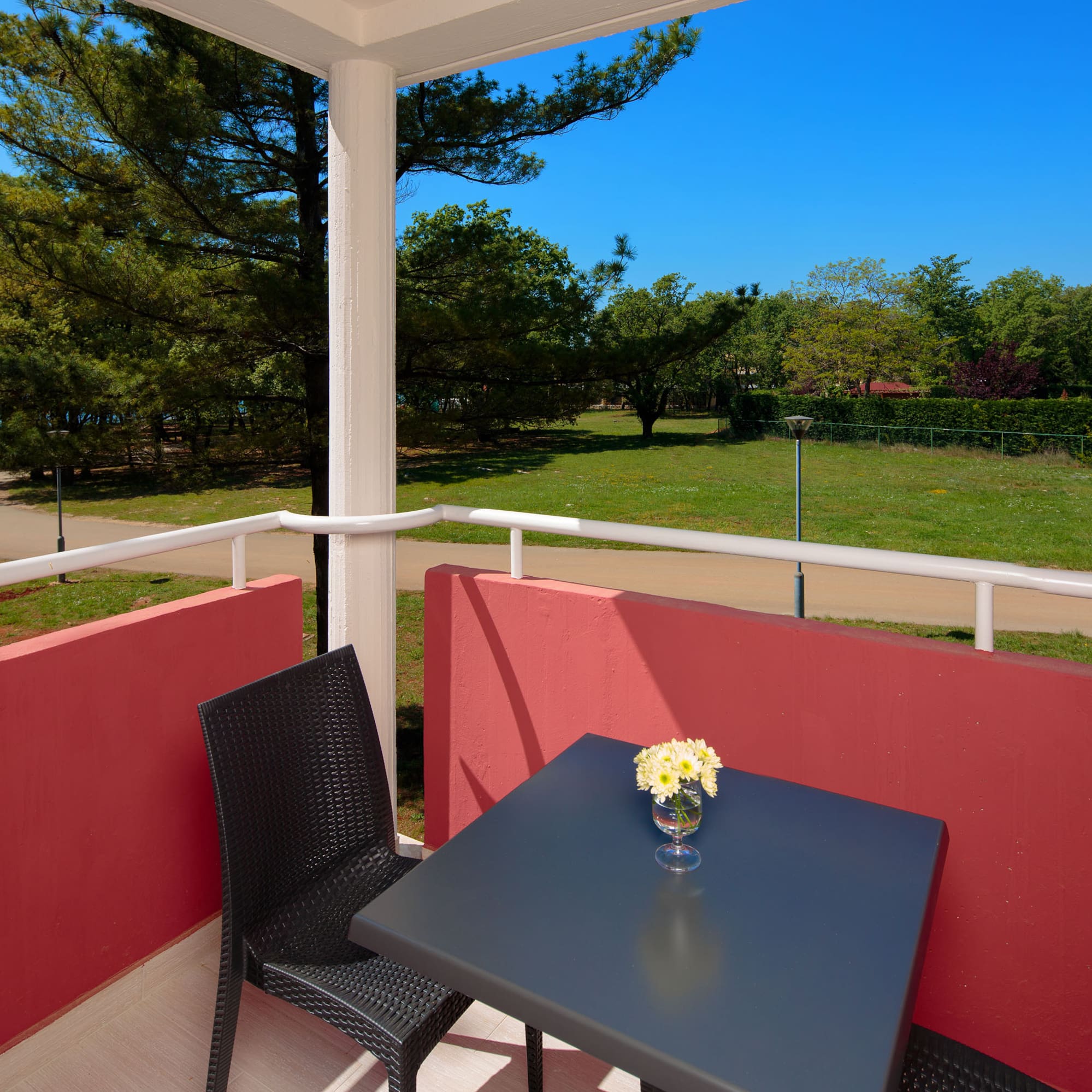 a table and chair on a balcony