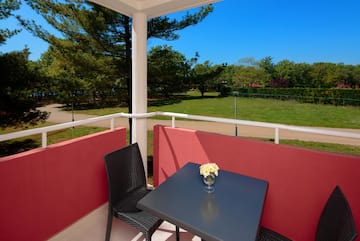 a table and chair on a balcony