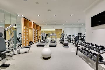 a room with exercise equipment and a ball