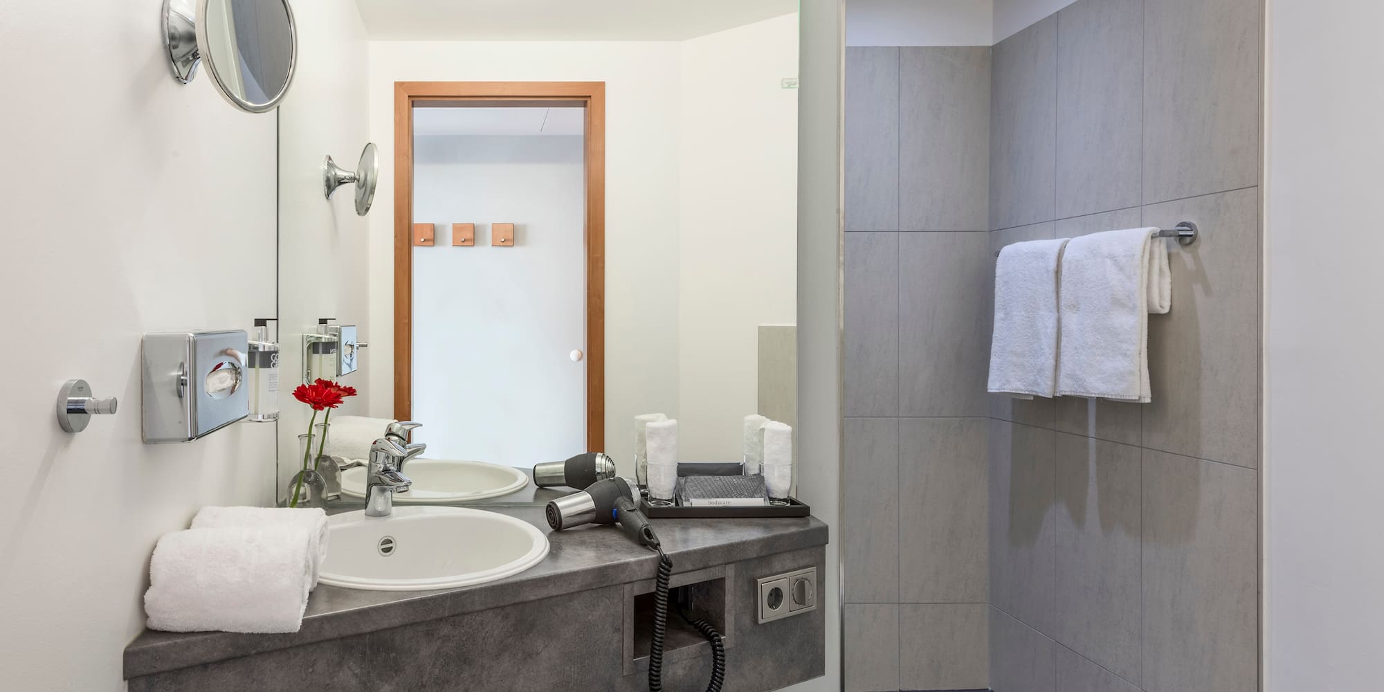 a bathroom with a sink and shower