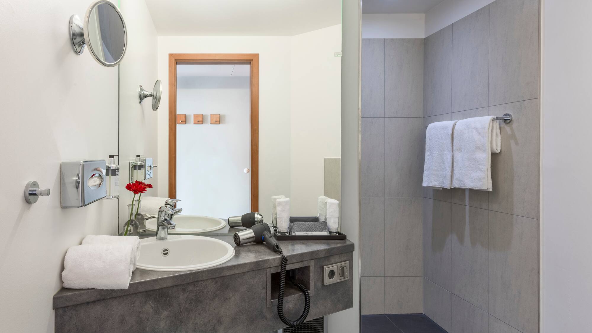 a bathroom with a sink and shower