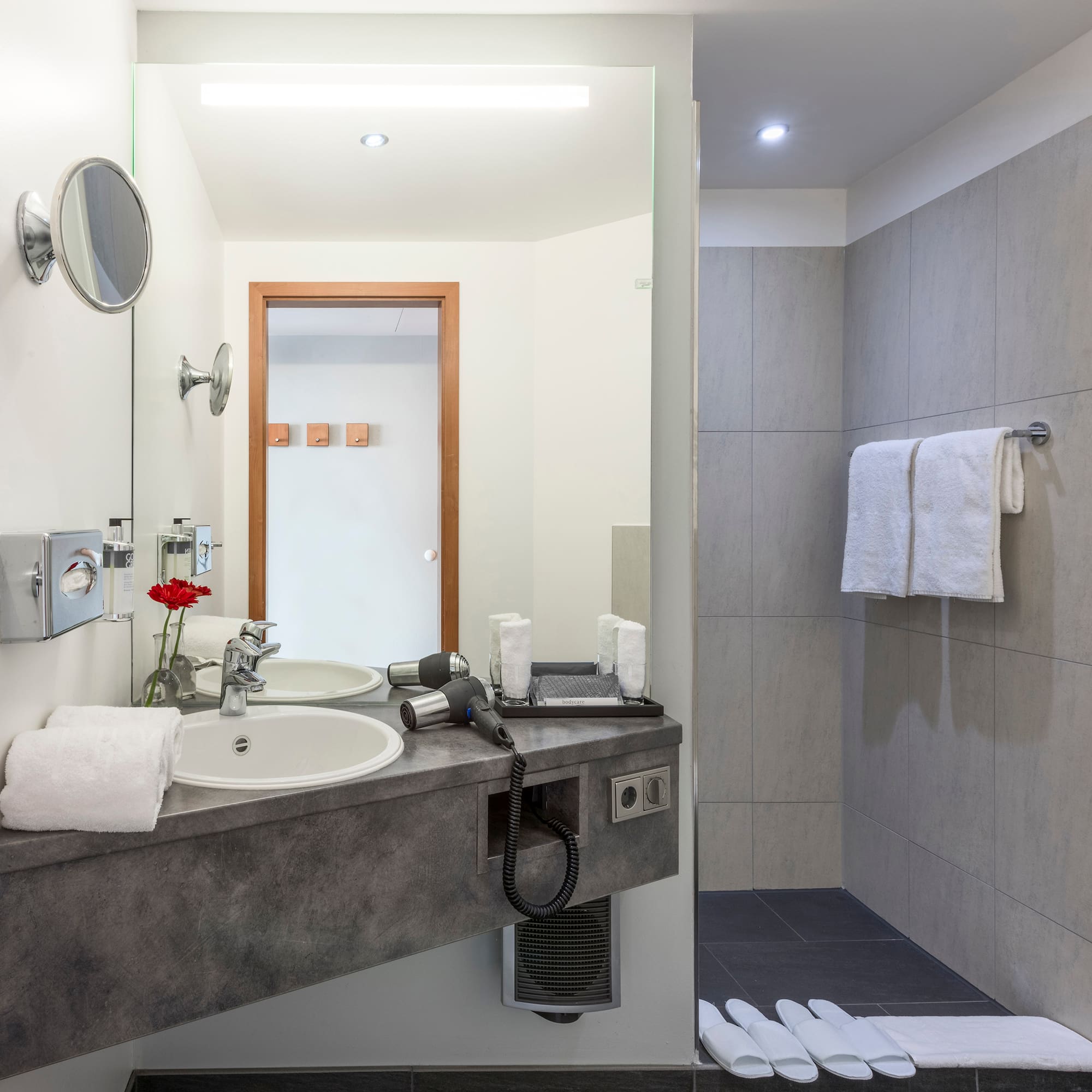 a bathroom with a sink and shower